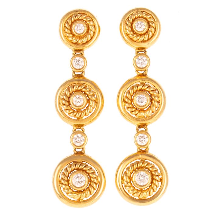 A Pair of Graduated Diamond Dangle Earrings in 18K
