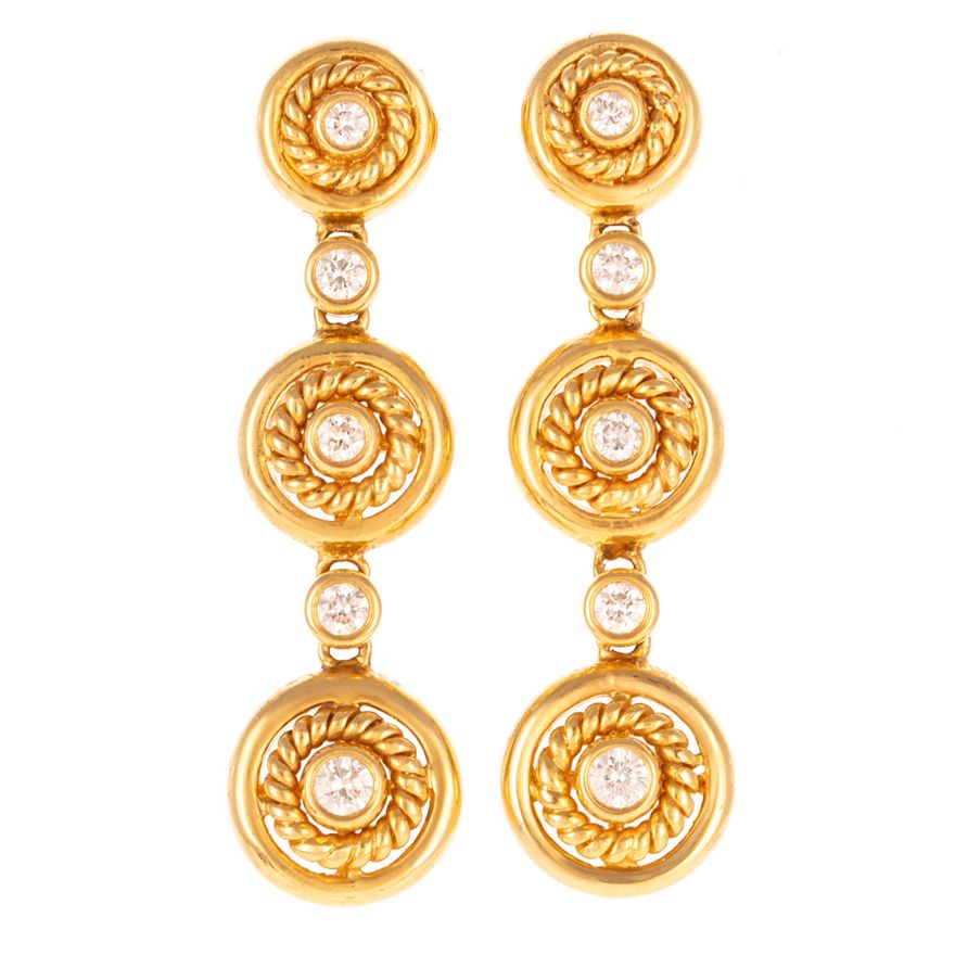 A Pair of Graduated Diamond Dangle Earrings in 18K