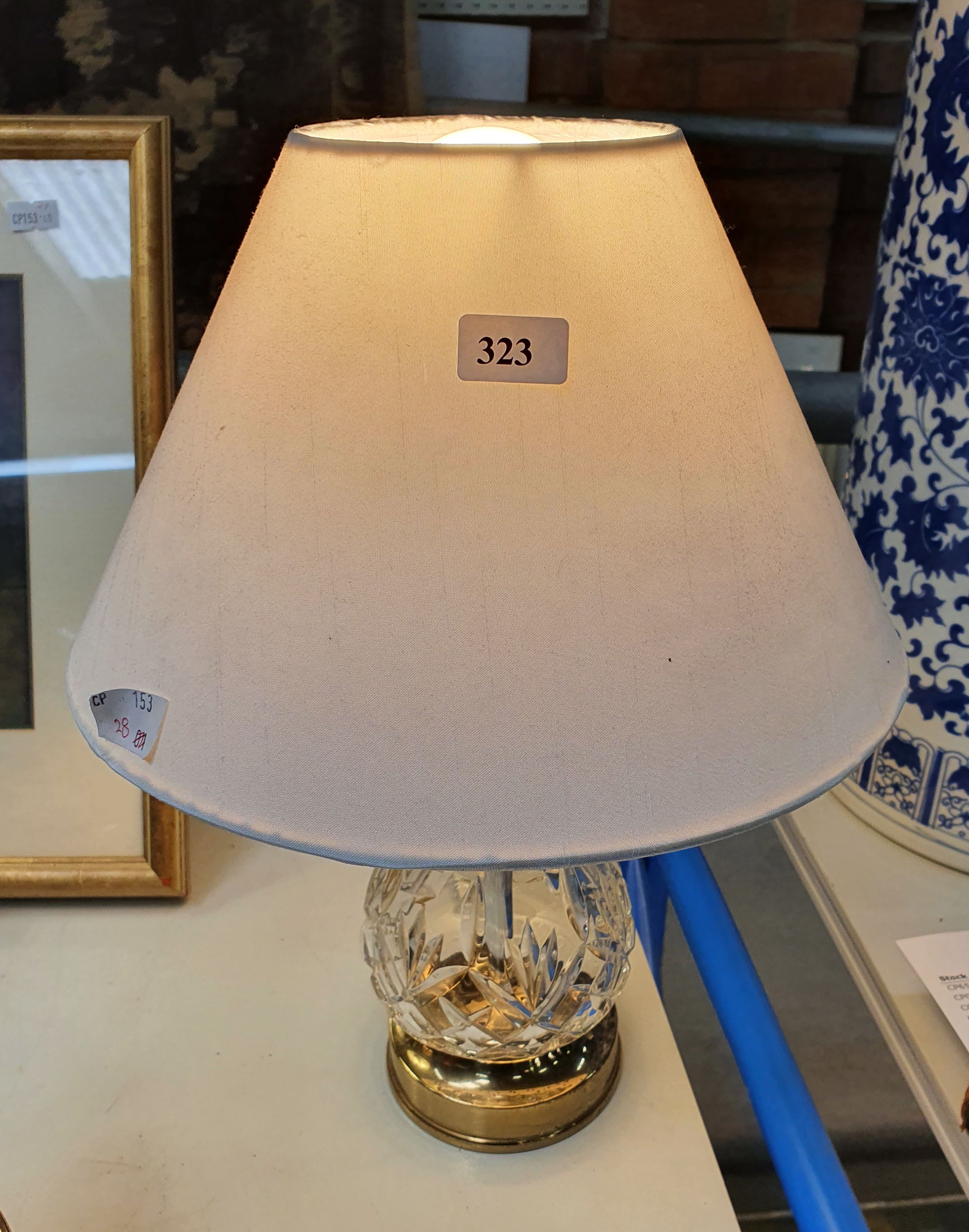 323 · AN CRYSTAL AND BRASS TABLE LAMP MADE IN IRELAND