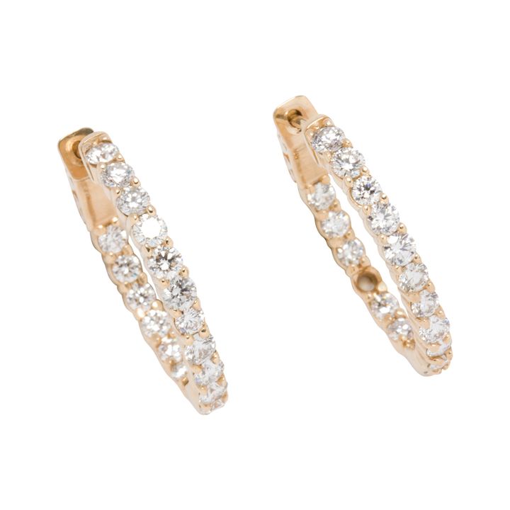 A pair of diamond and 14k gold hoop earrings