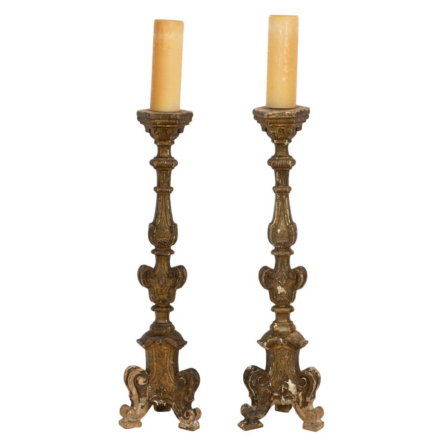 A pair of Continental Baroque giltwood candle prickets, 18th century