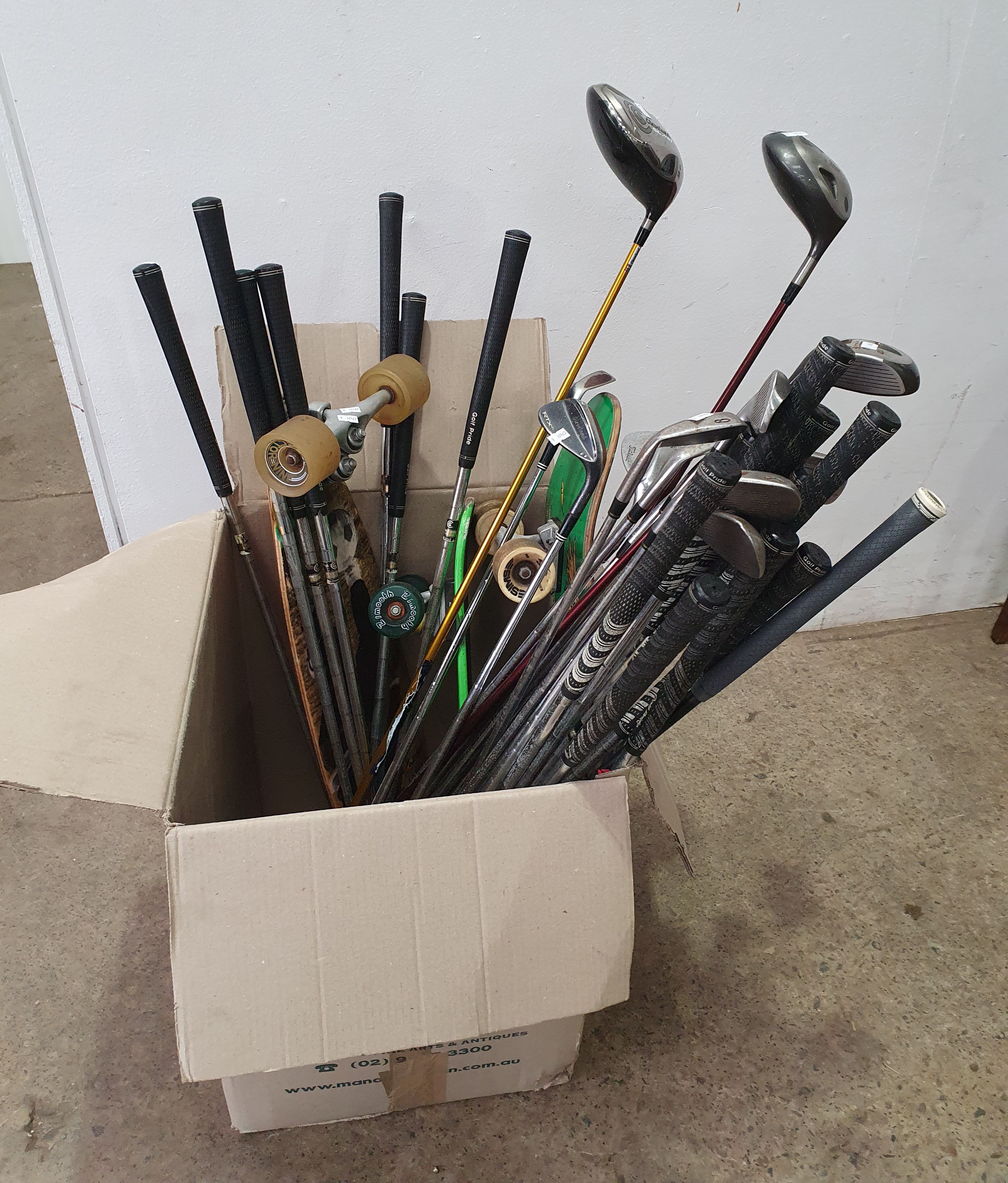 1204 · A BOX OF GOLF CLUBS AND SKATEBOARDS