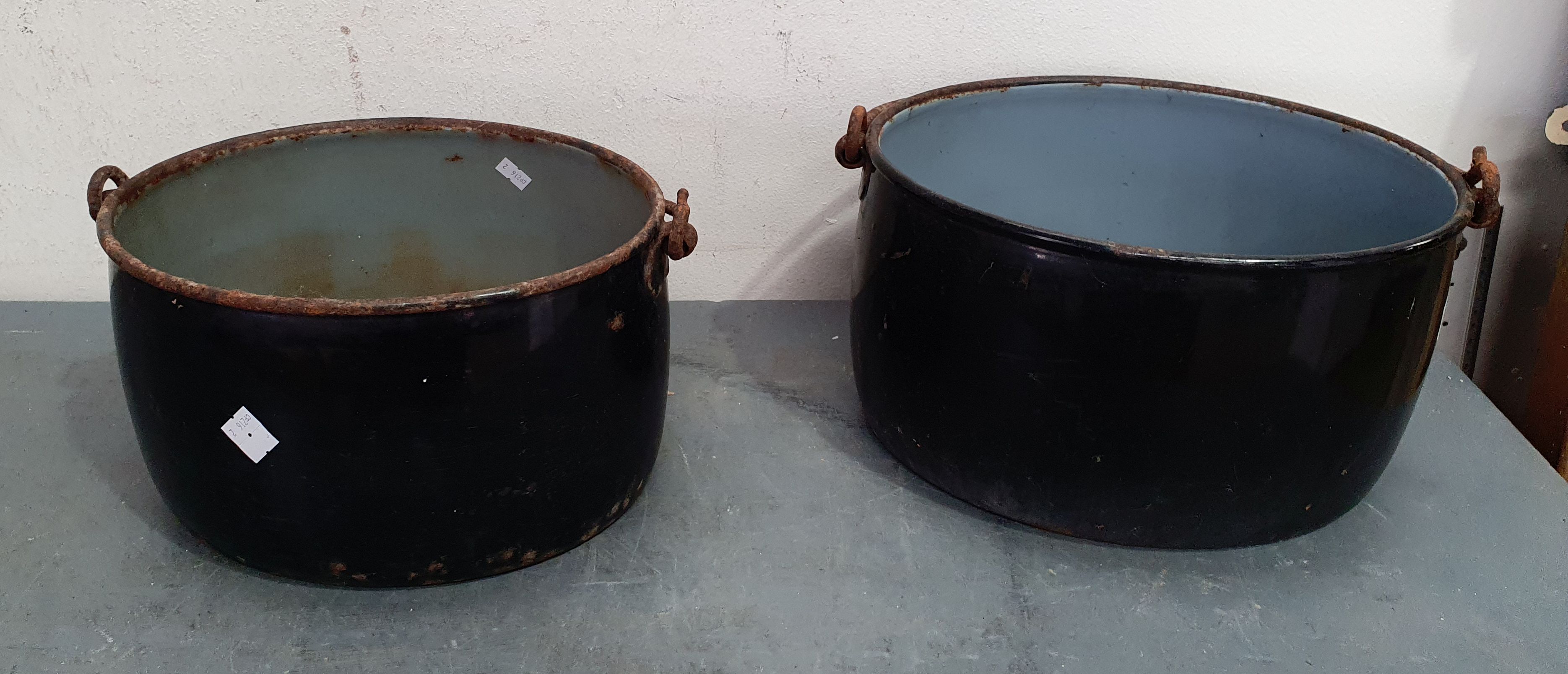 A Pair Of Black Enamel Cauldron Pots