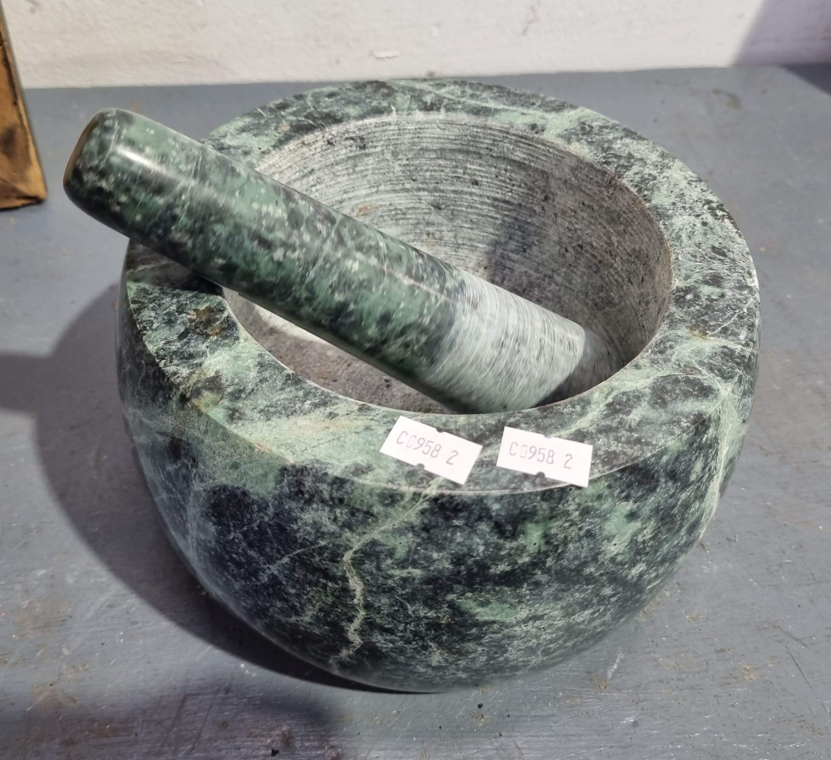 1238 · A STONE MORTAR AND PESTLE
