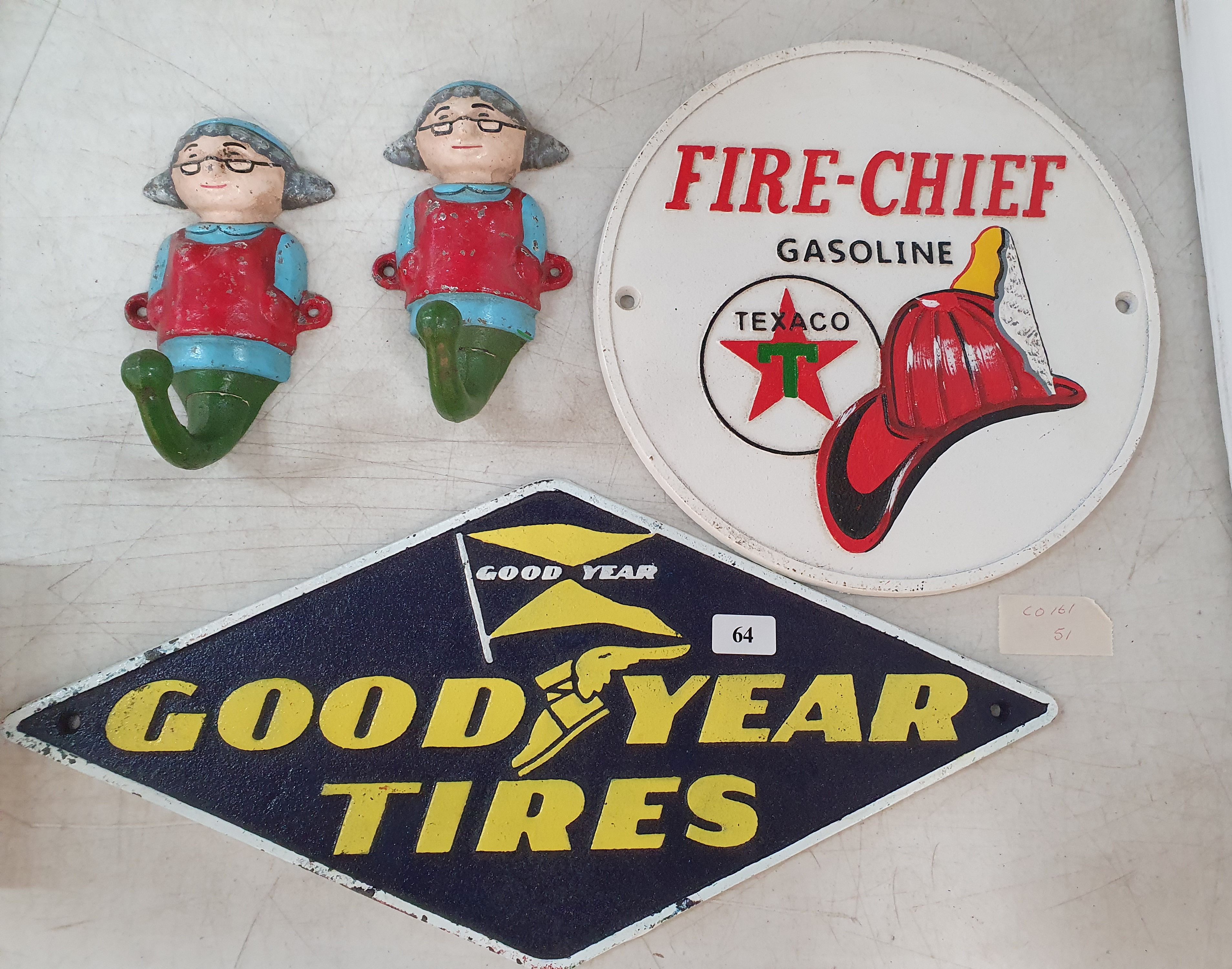 64 · A REPRODUCTION CAST IRON PAIR OF 'GIRL WITH GLASSES' COAT HOOKS