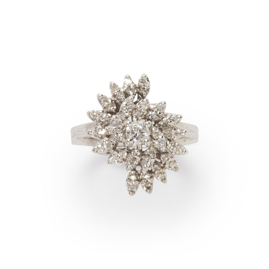 A diamond and fourteen karat white gold ring