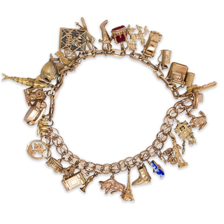 A mostly fourteen karat gold charm bracelet