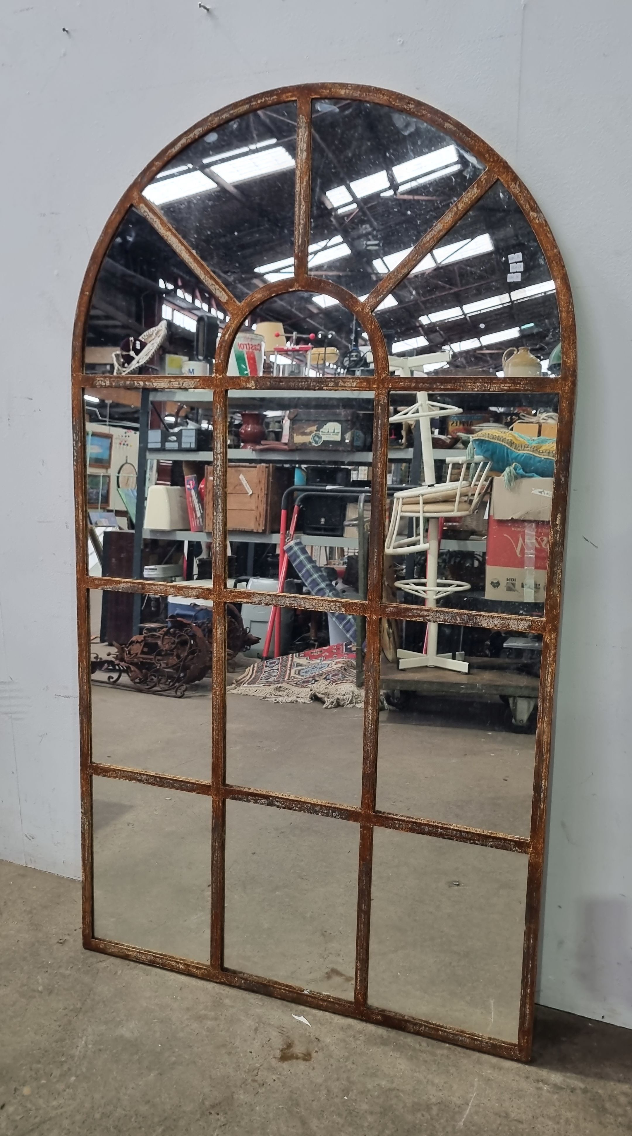 2068A · A RUSTIC METAL FRAME ARCH SHAPE MIRROR