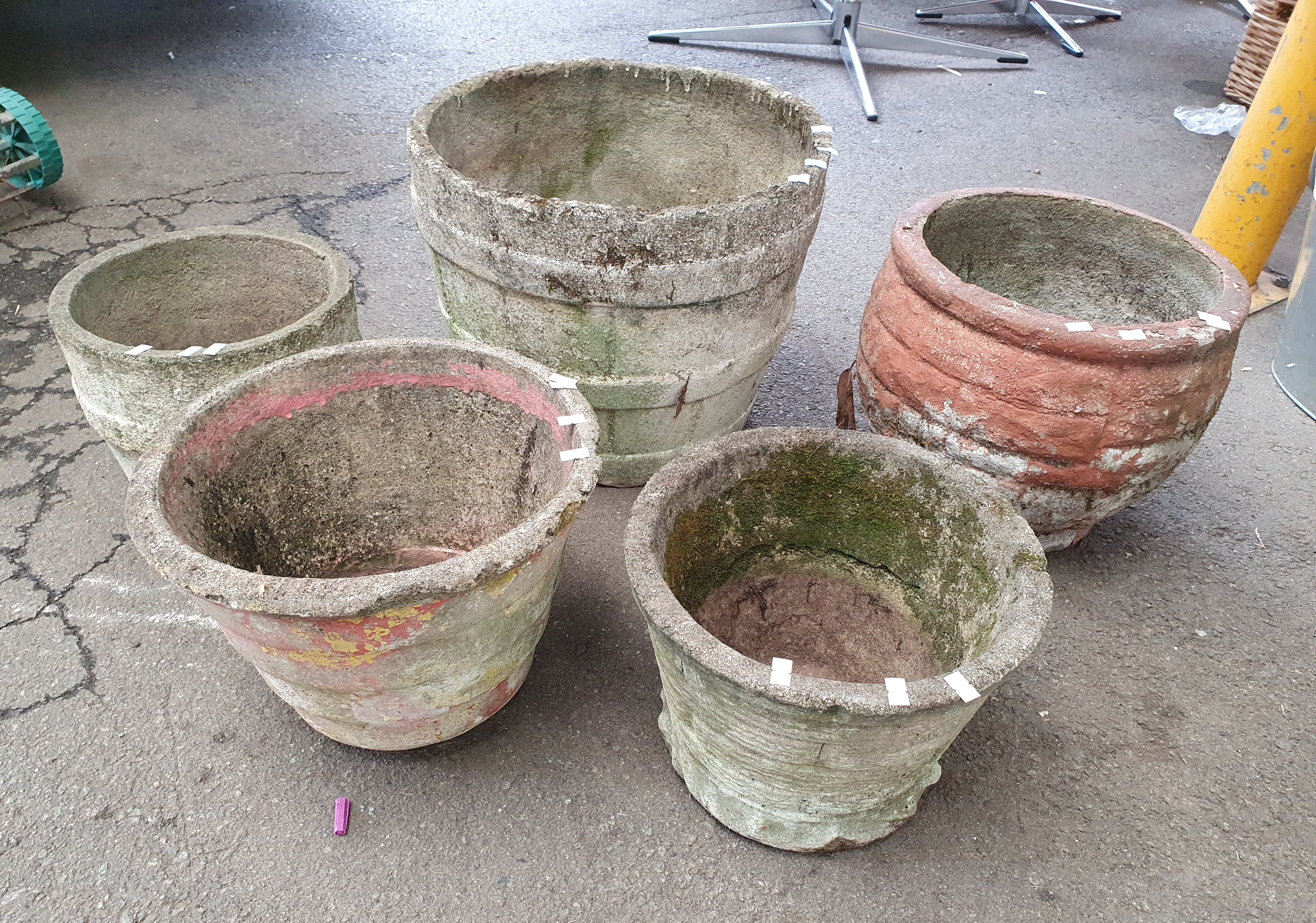 1055 · A GROUP OF CONCRETE POTS