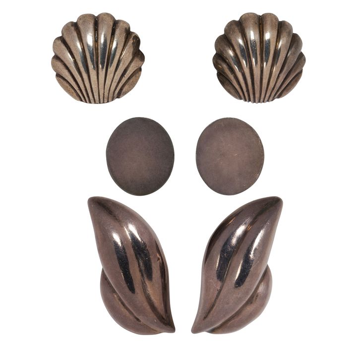 A group of silver earclips