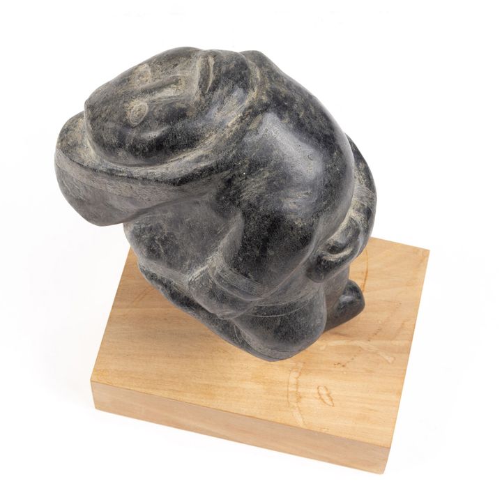 An Inuit Cape Dorset soapstone figure of dancer looking up at the Northern Lights
