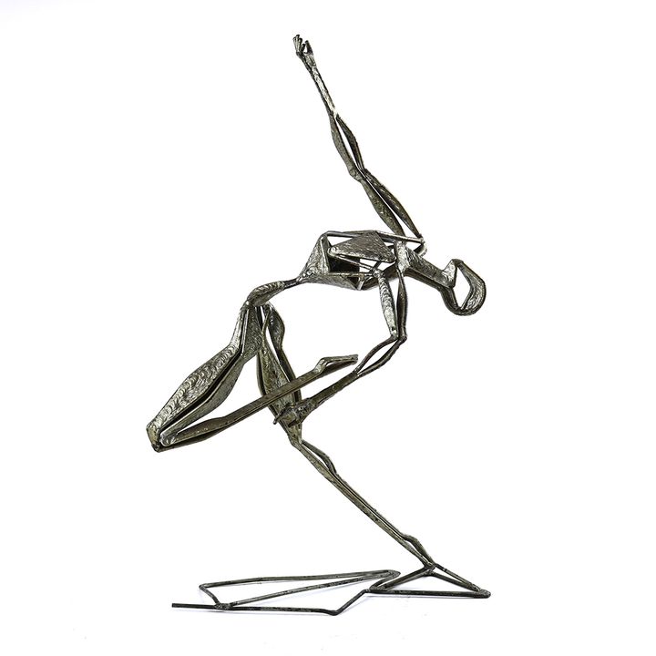Contemporary silvered metal sculpture depicting a female in dance pose