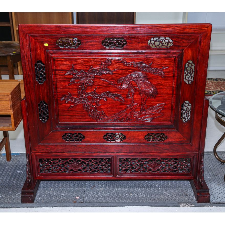 A Chinese Carved Mahogany Floor Screen