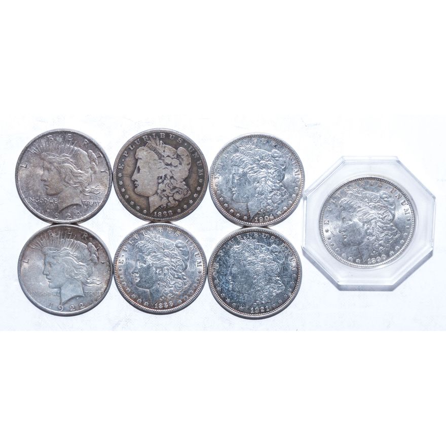 Seven US Silver Dollars
