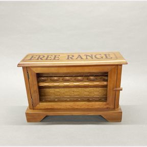 A traditional wooden egg box, W. 38cm H. 25cm.