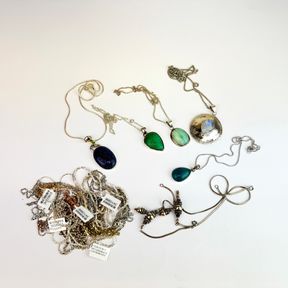 A quantity of silver semi precious stone set necklaces together with further silver necklaces and chains.