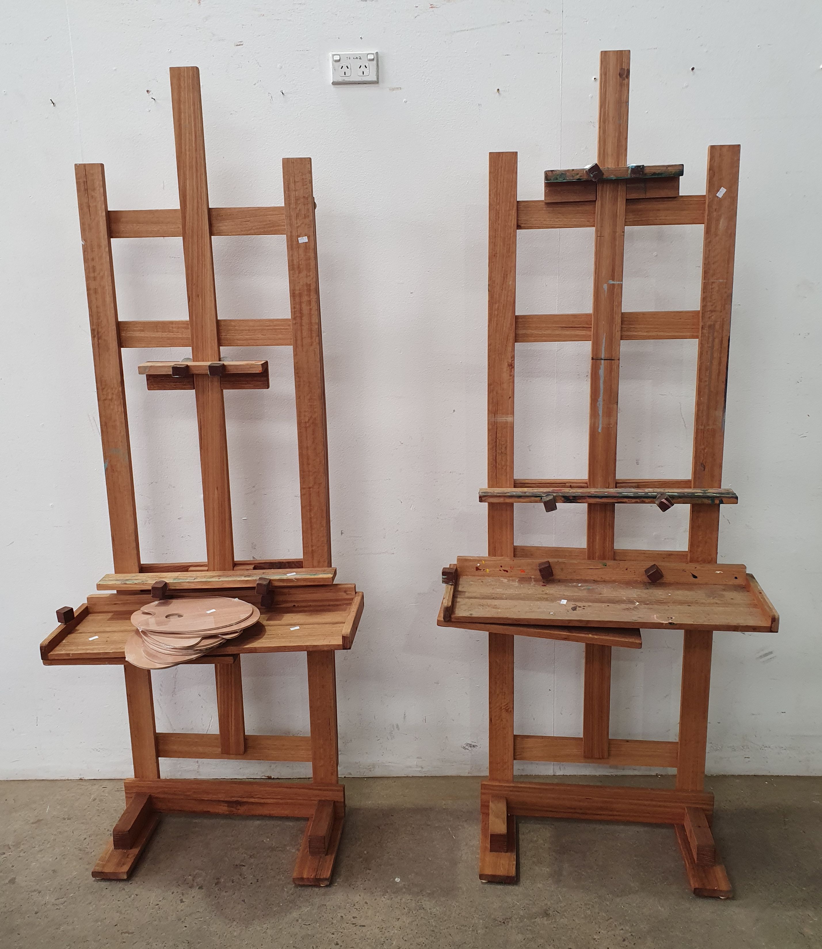 A PAIR OF ADJUSTABLE H-FRAME ARTIST EASELS
