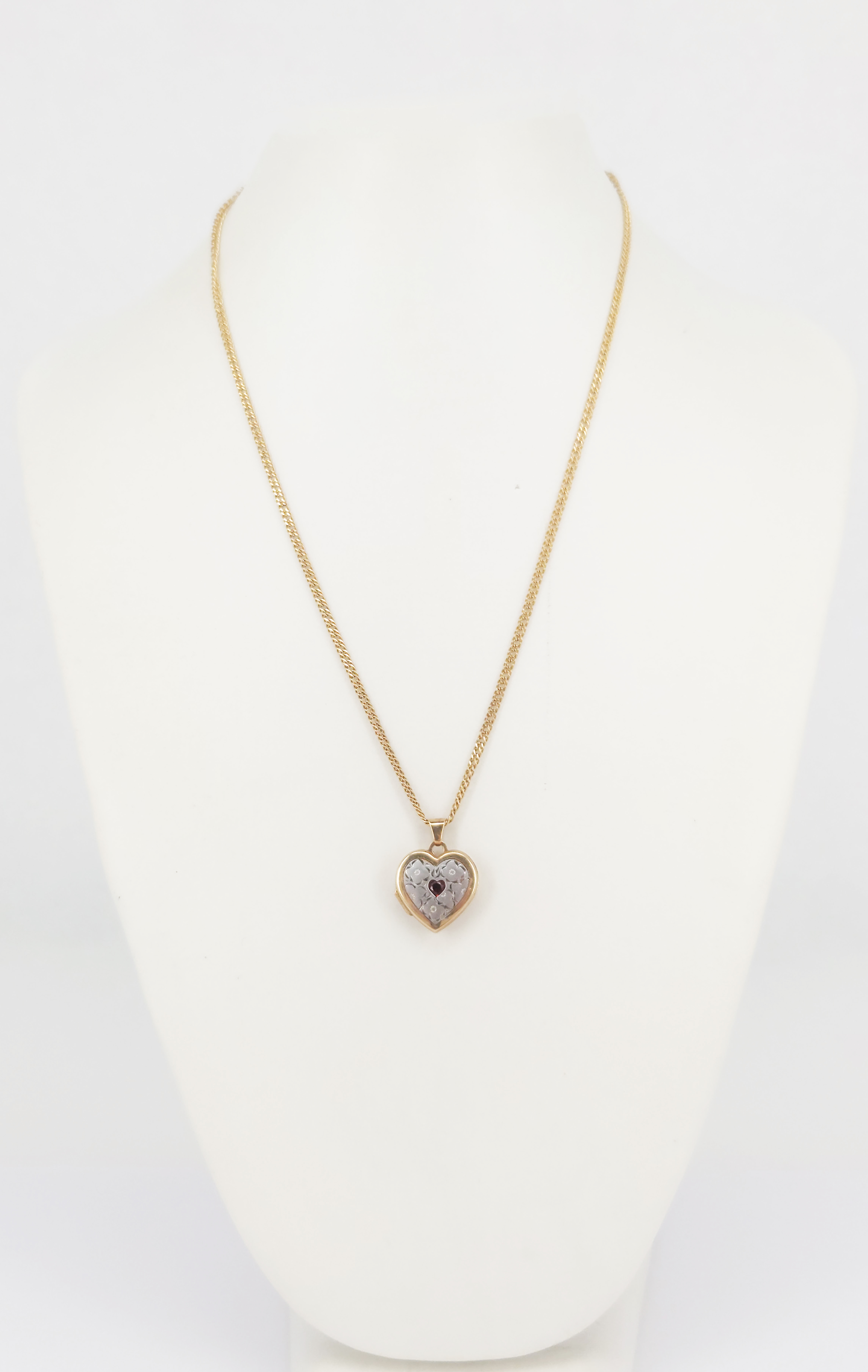 A 9ct Two-Tone Gold Garnet-Set Heart Locket On A 9ct Yellow Gold Chain
