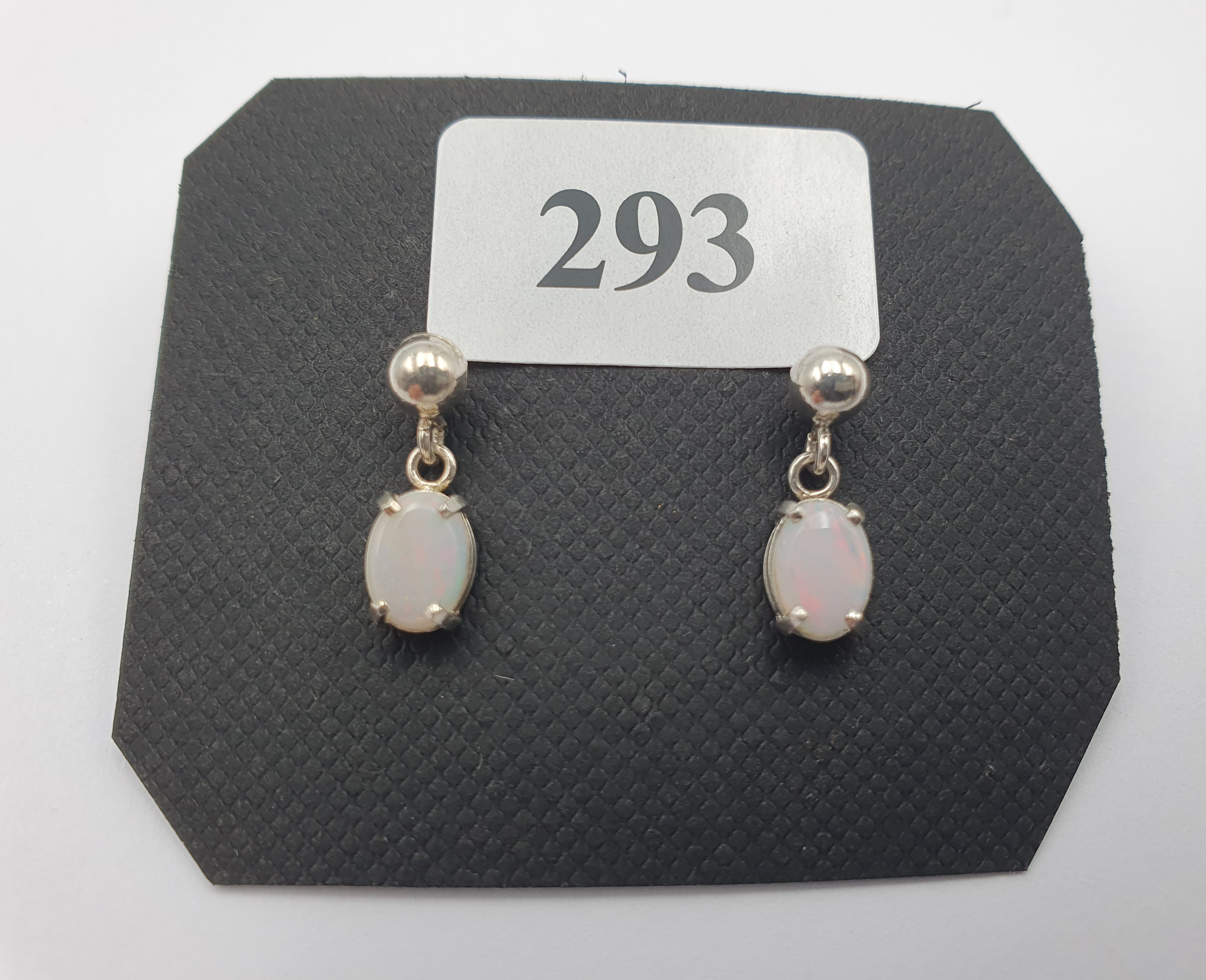 293 · A PAIR OF SILVER AND OPAL EARRINGS