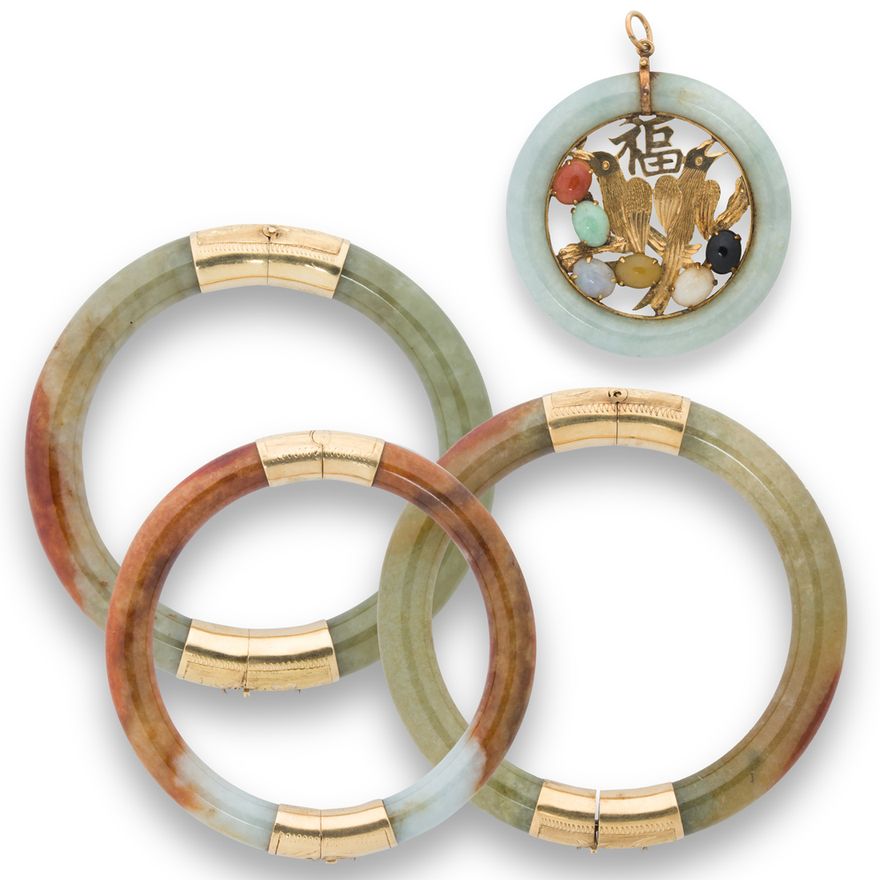 A group of jade and fourteen karat gold jewelry