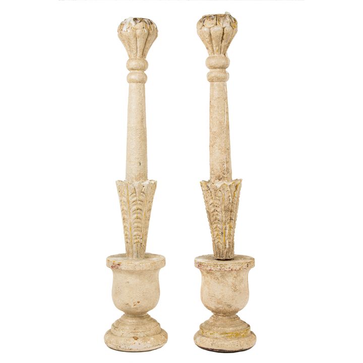 A pair of paint decorated candlesticks in a baluster form