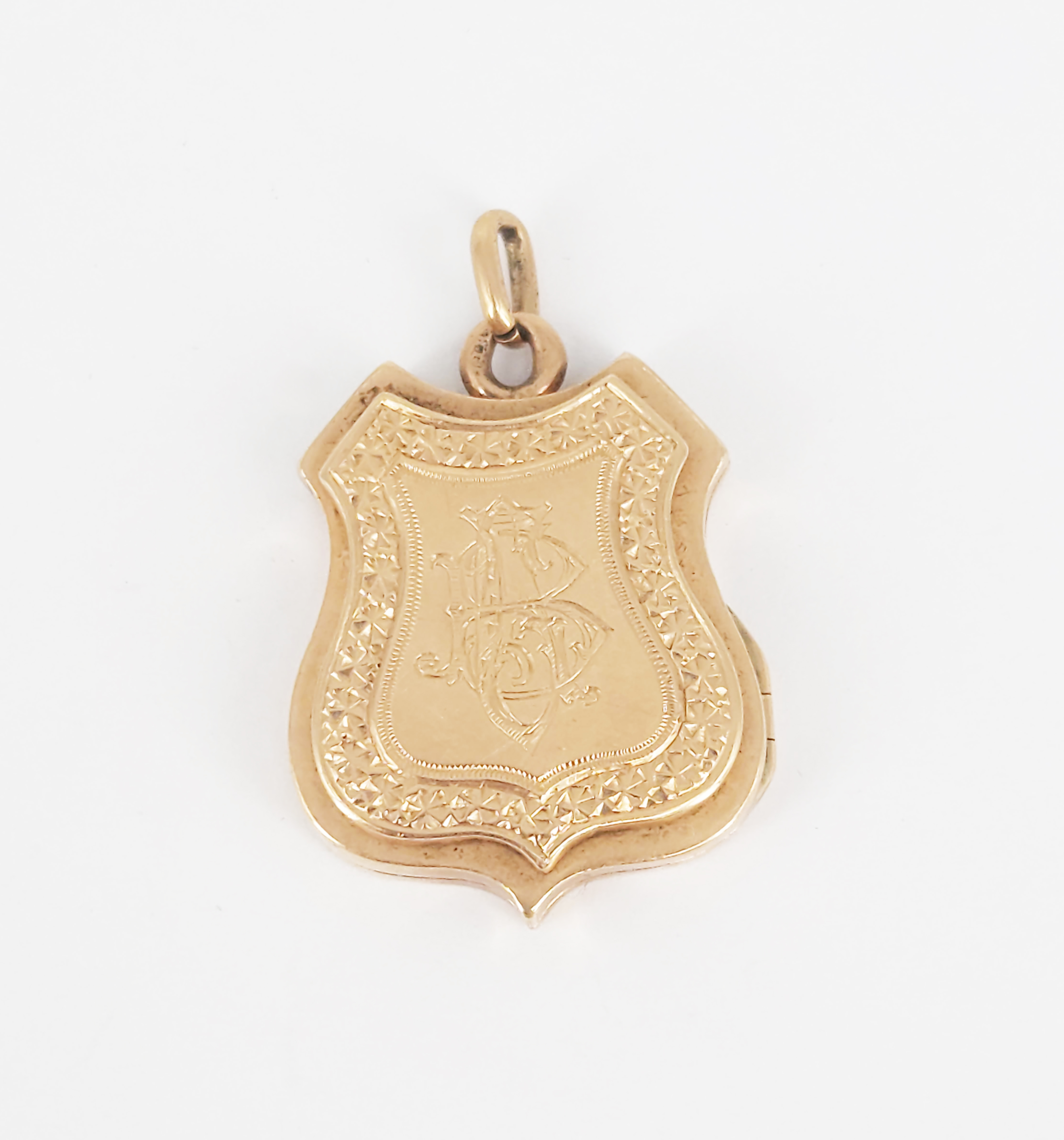 A Yellow Gold Shield Locket