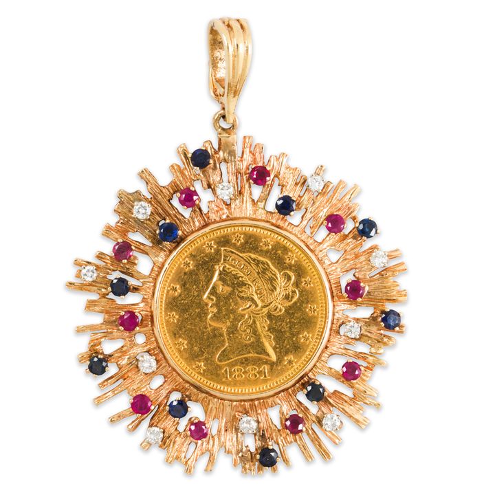 A gold coin, gemstone and gold pendant