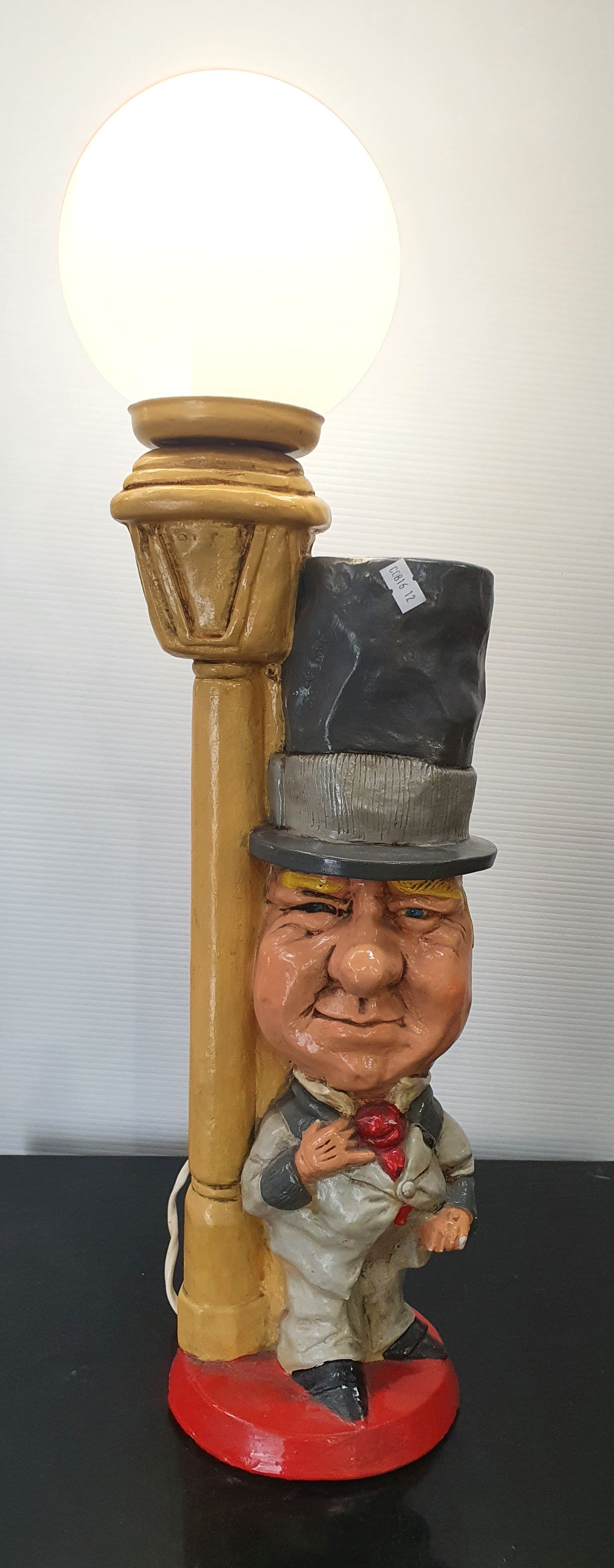 254 · A HANDPAINTED CHALKWARE FIGURAL LAMP OF 'W C FIELDS'