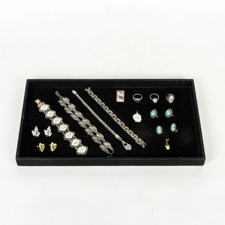 A lot of mostly sterling silver jewelry, some with enamel enamel work including a Danecraft leaf tendril bracelet; rings and earrings