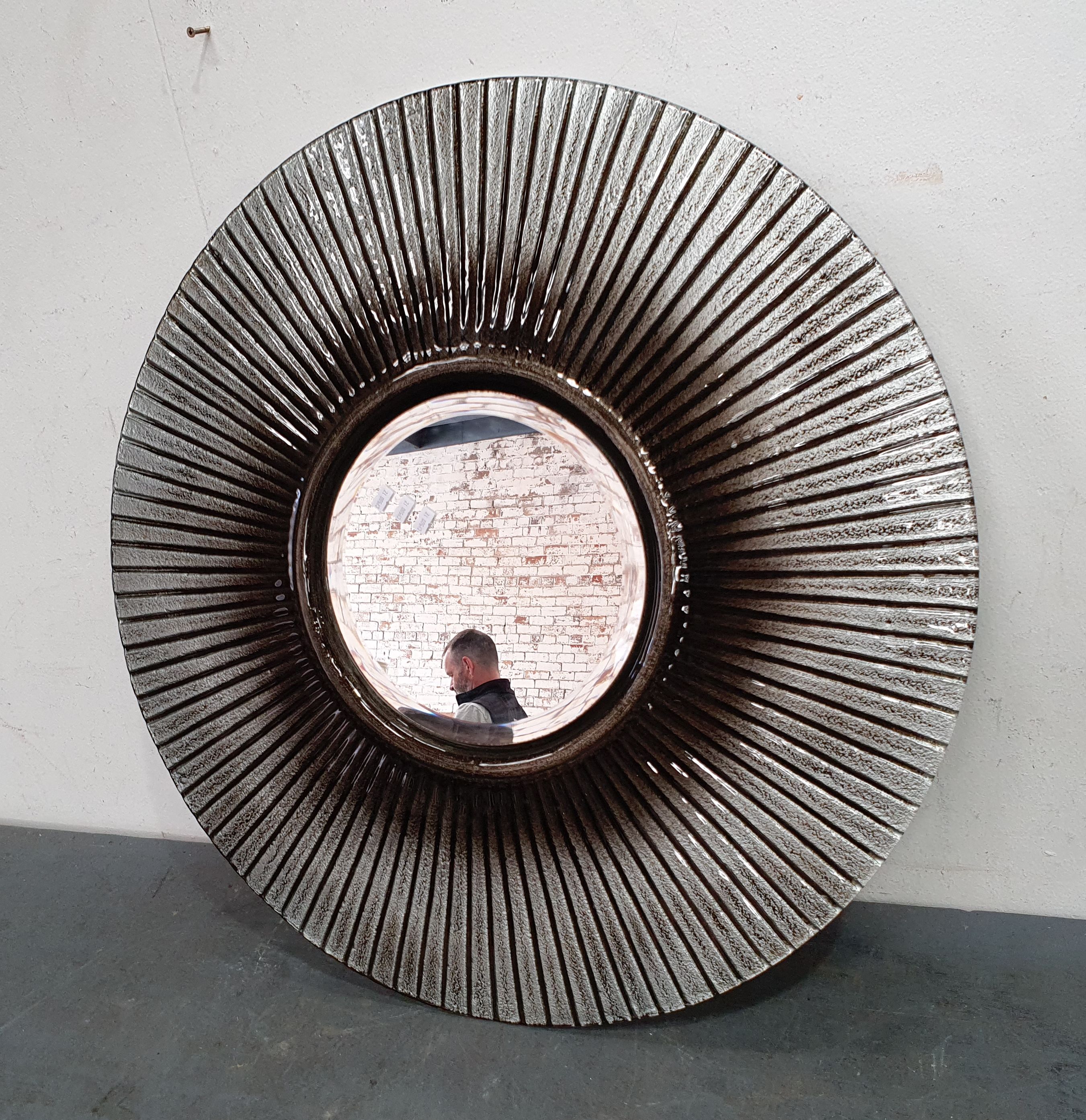 A Glass Framed Circular Mirror
