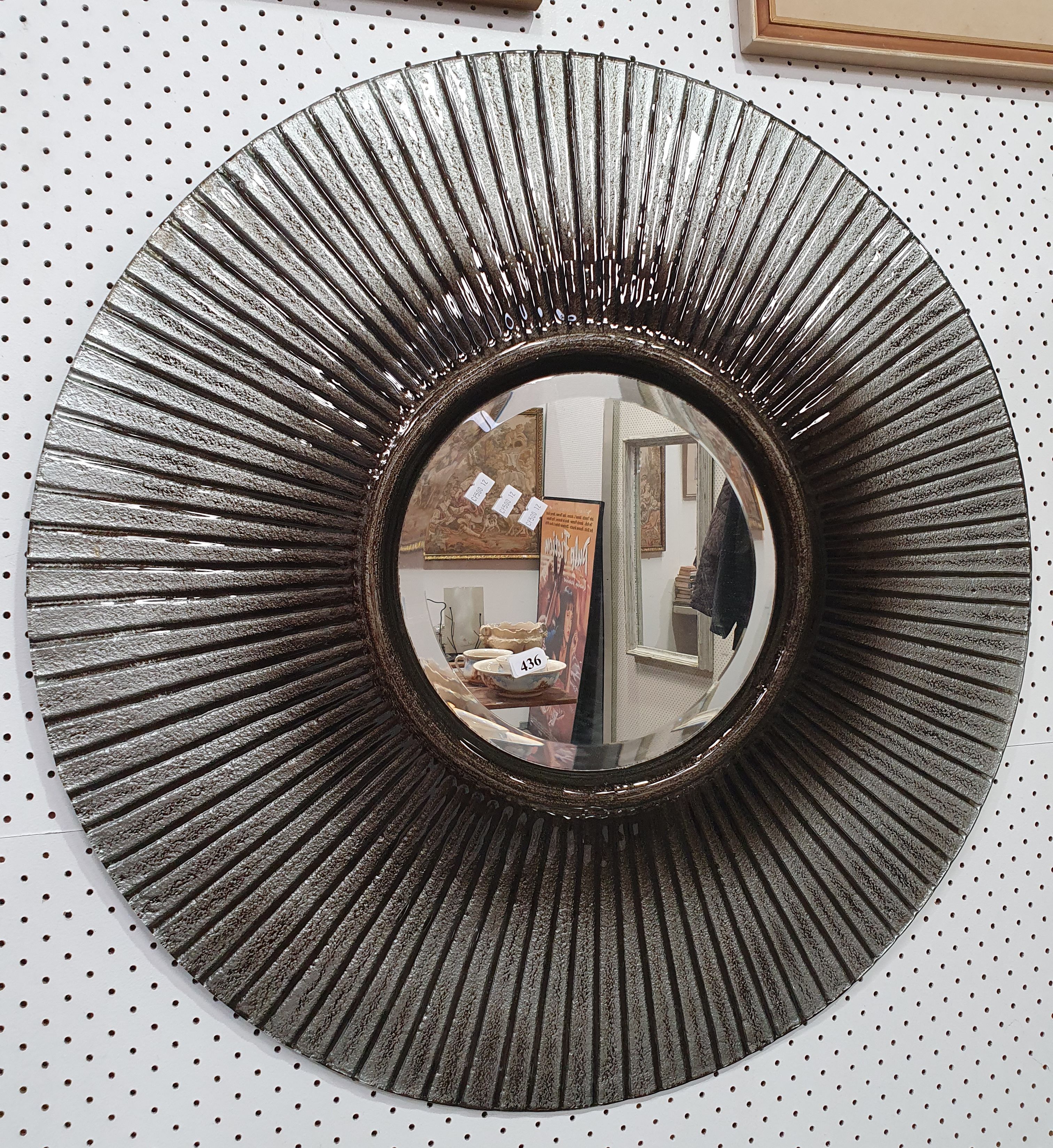 A Glass Framed Circular Mirror