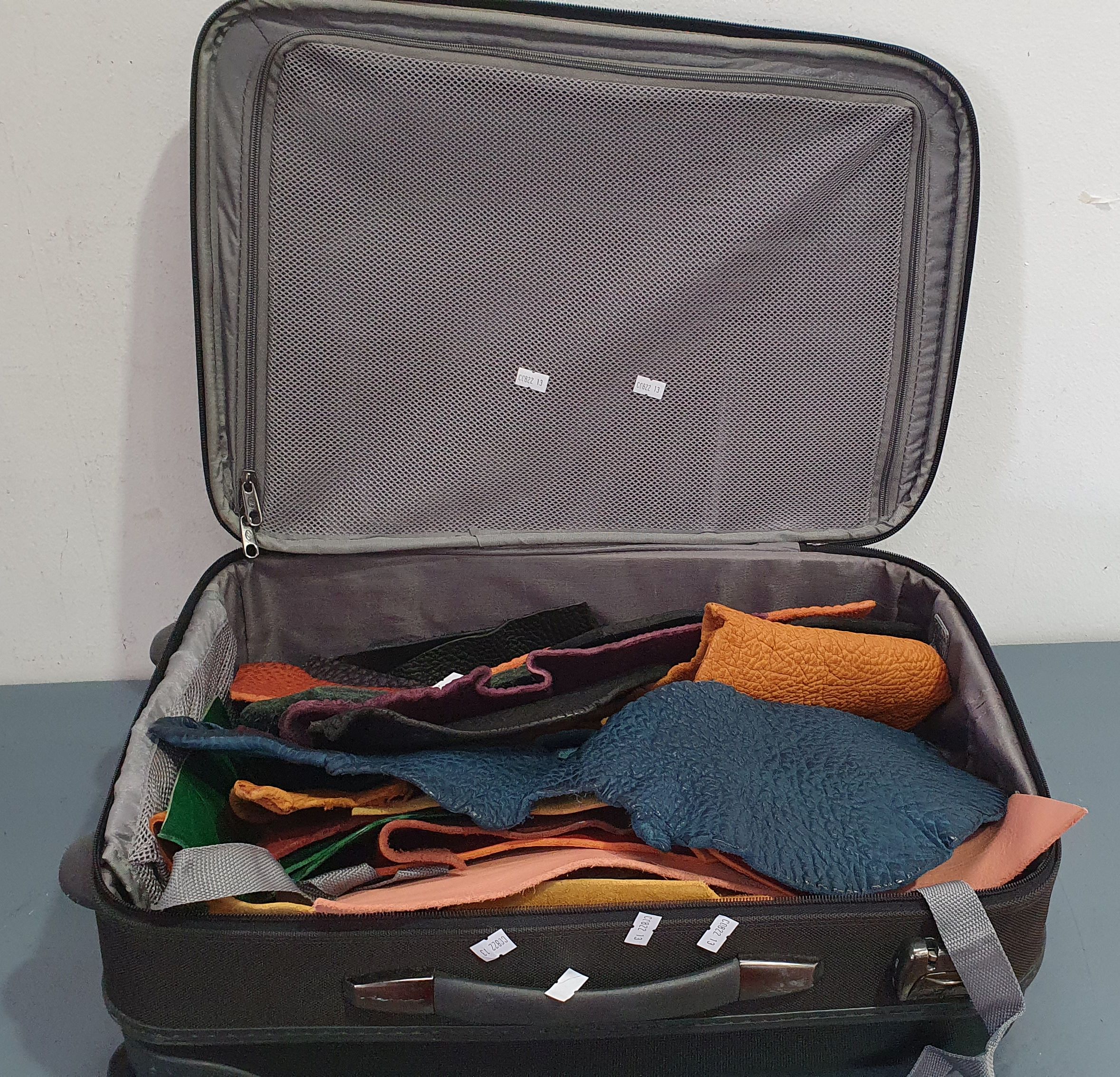 A Bag Of Various Leather Off Cuts