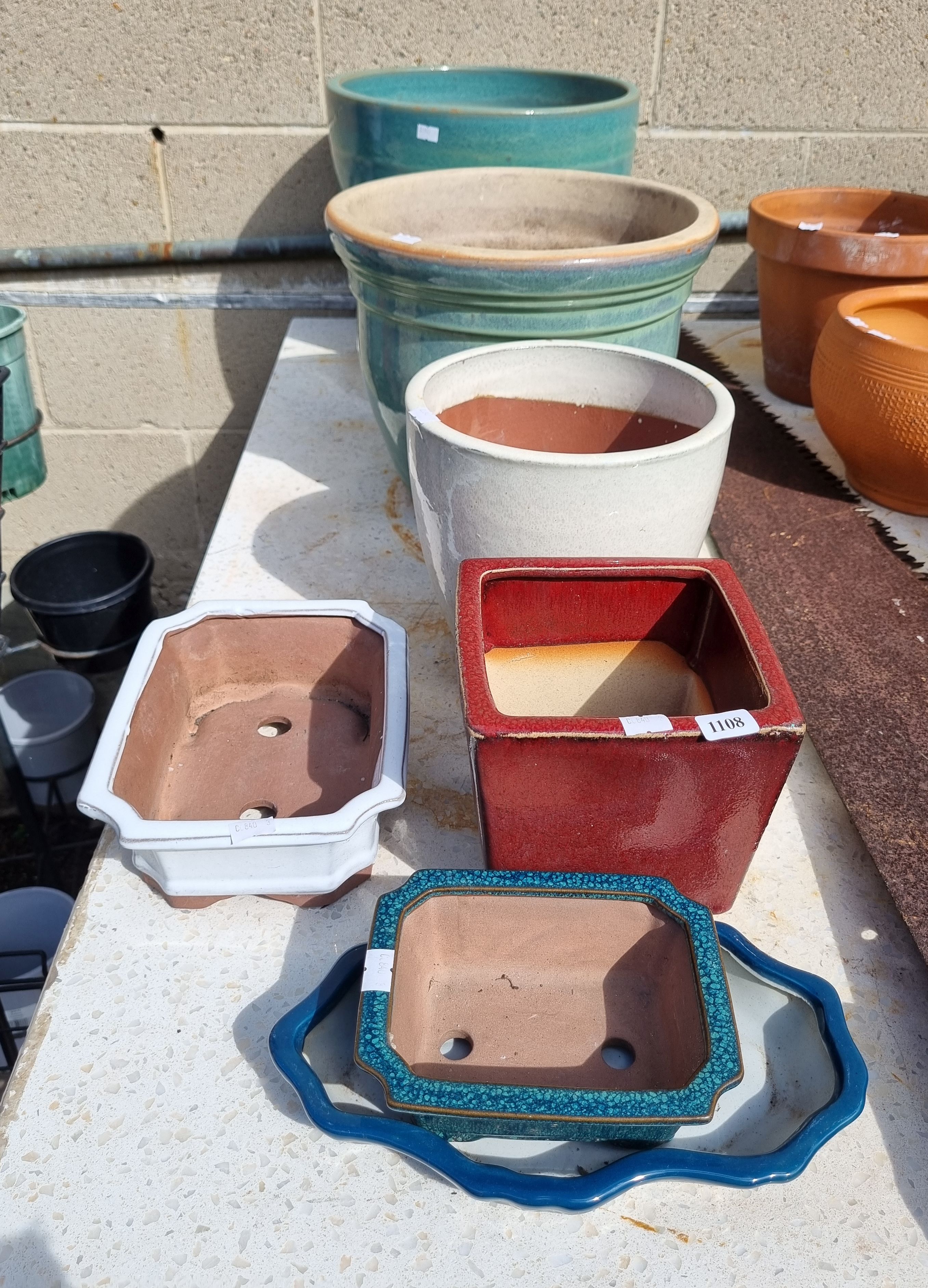 A Group Of Seven Glazed Pots