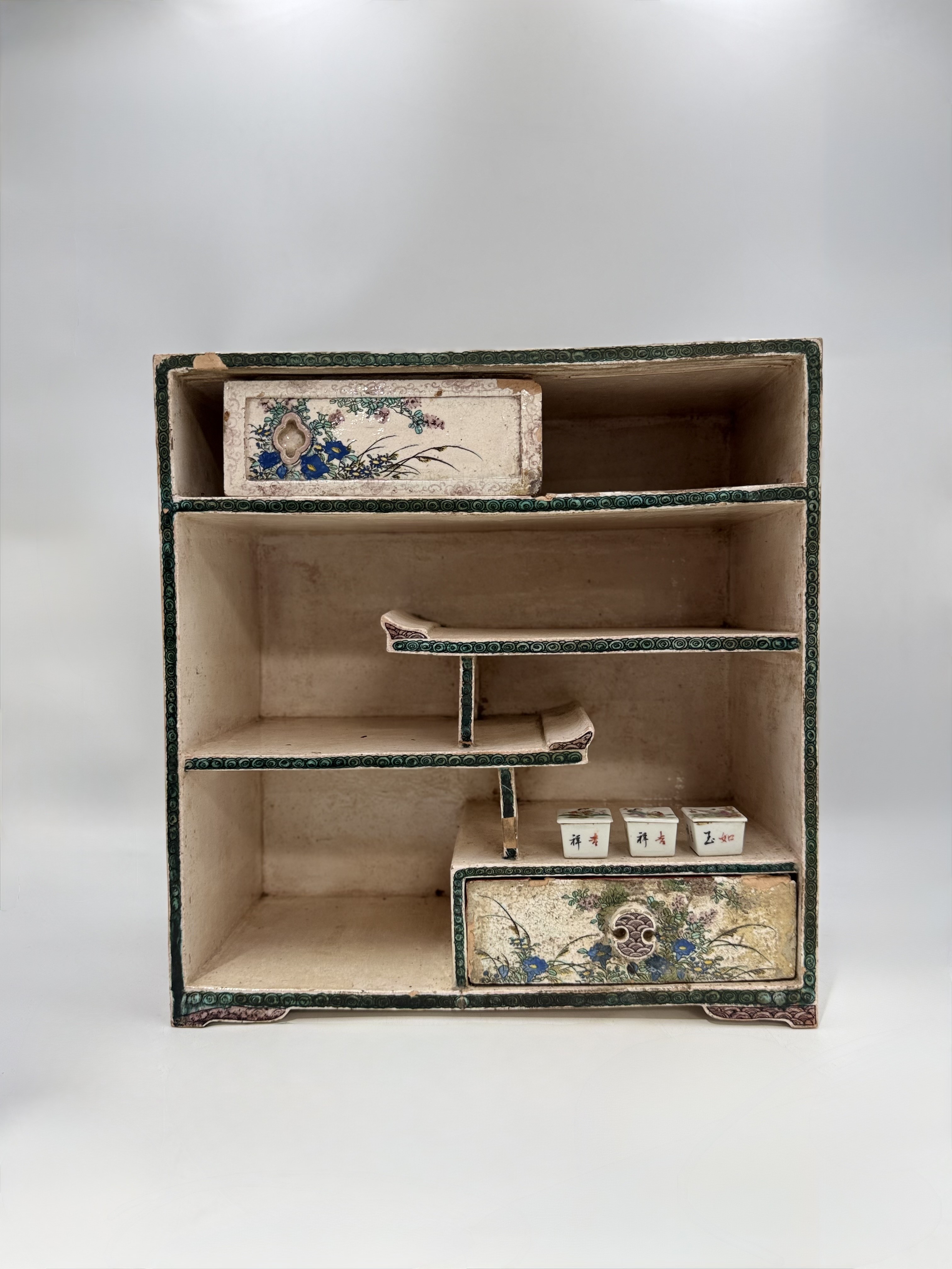 A JAPANESE KUTANI POTTERY TABLE CABINET