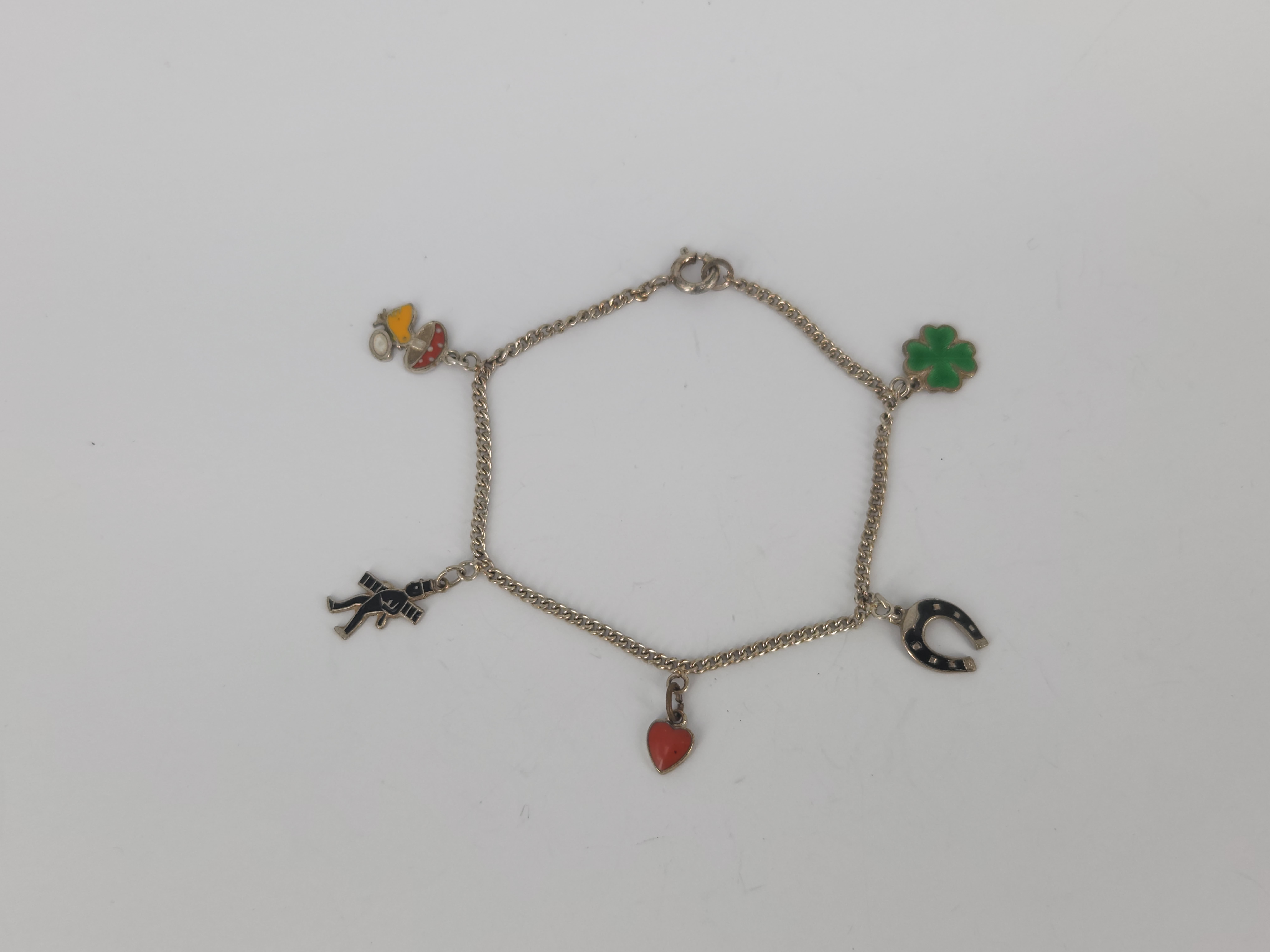 443 · A SILVER ENAMEL CHARM BRACELET