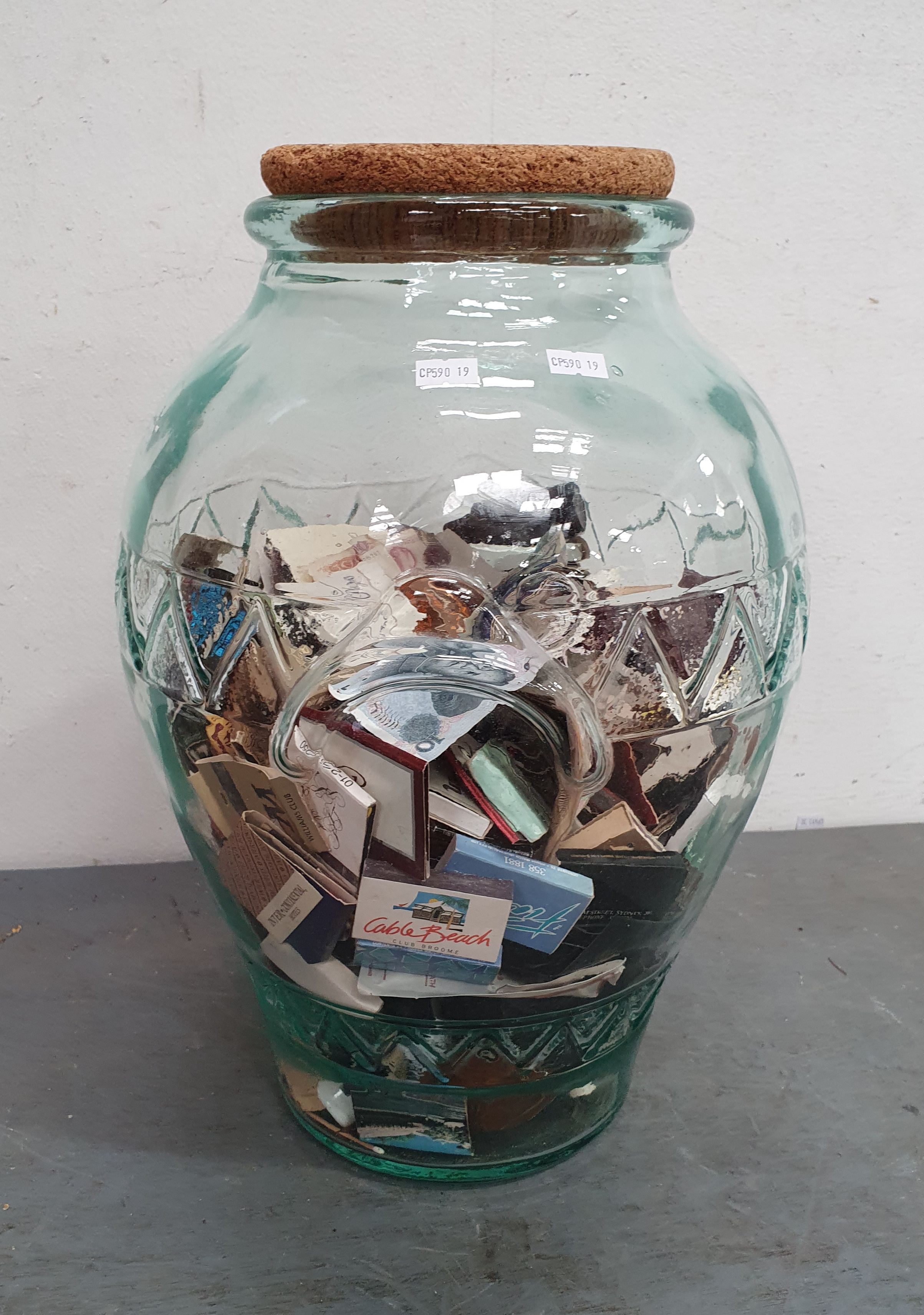 A LARGE VINTAGE JAR FILLED WITH MATCHSTICKS