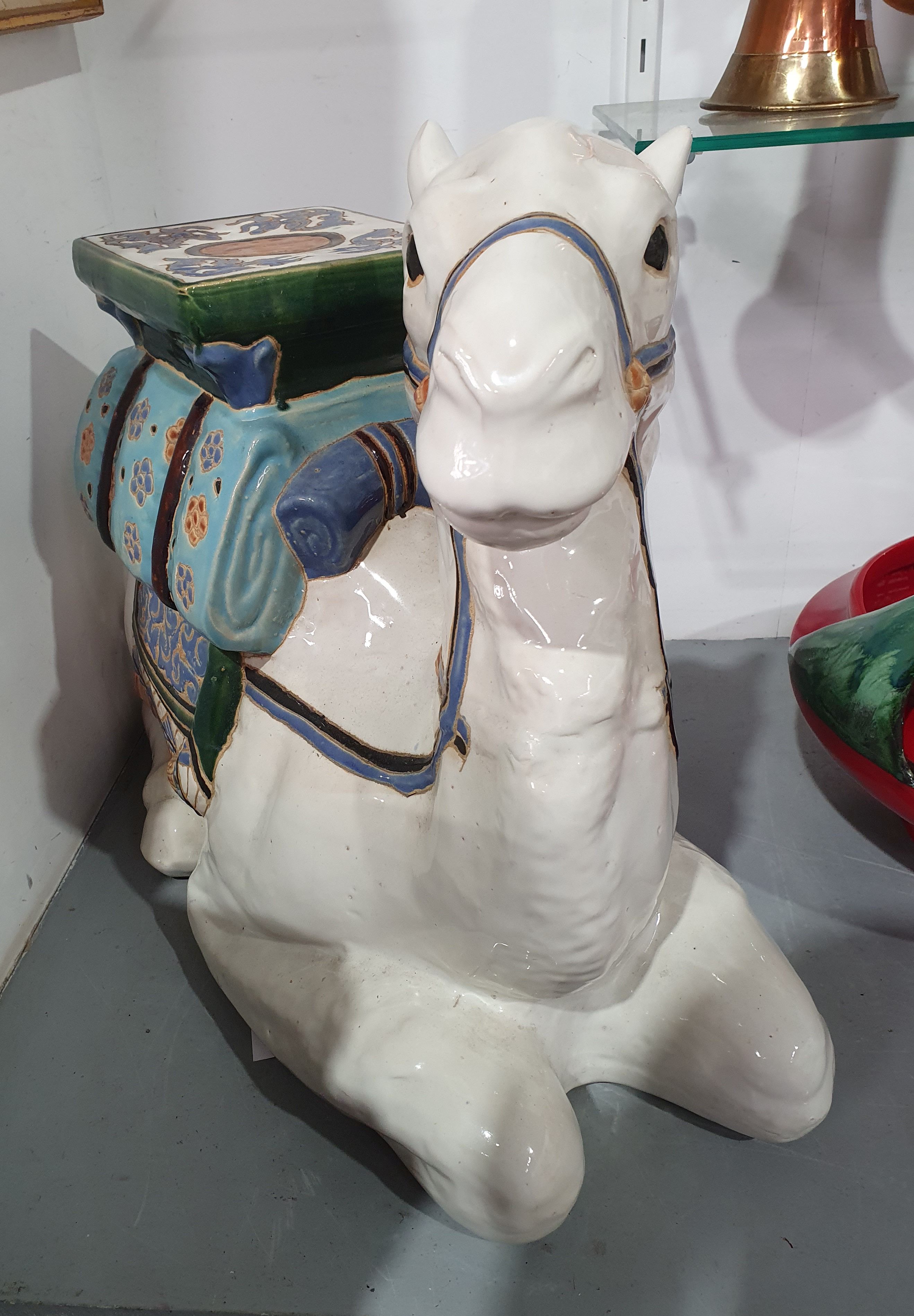 692 · A CAMEL FORM CERAMIC PLANT STAND