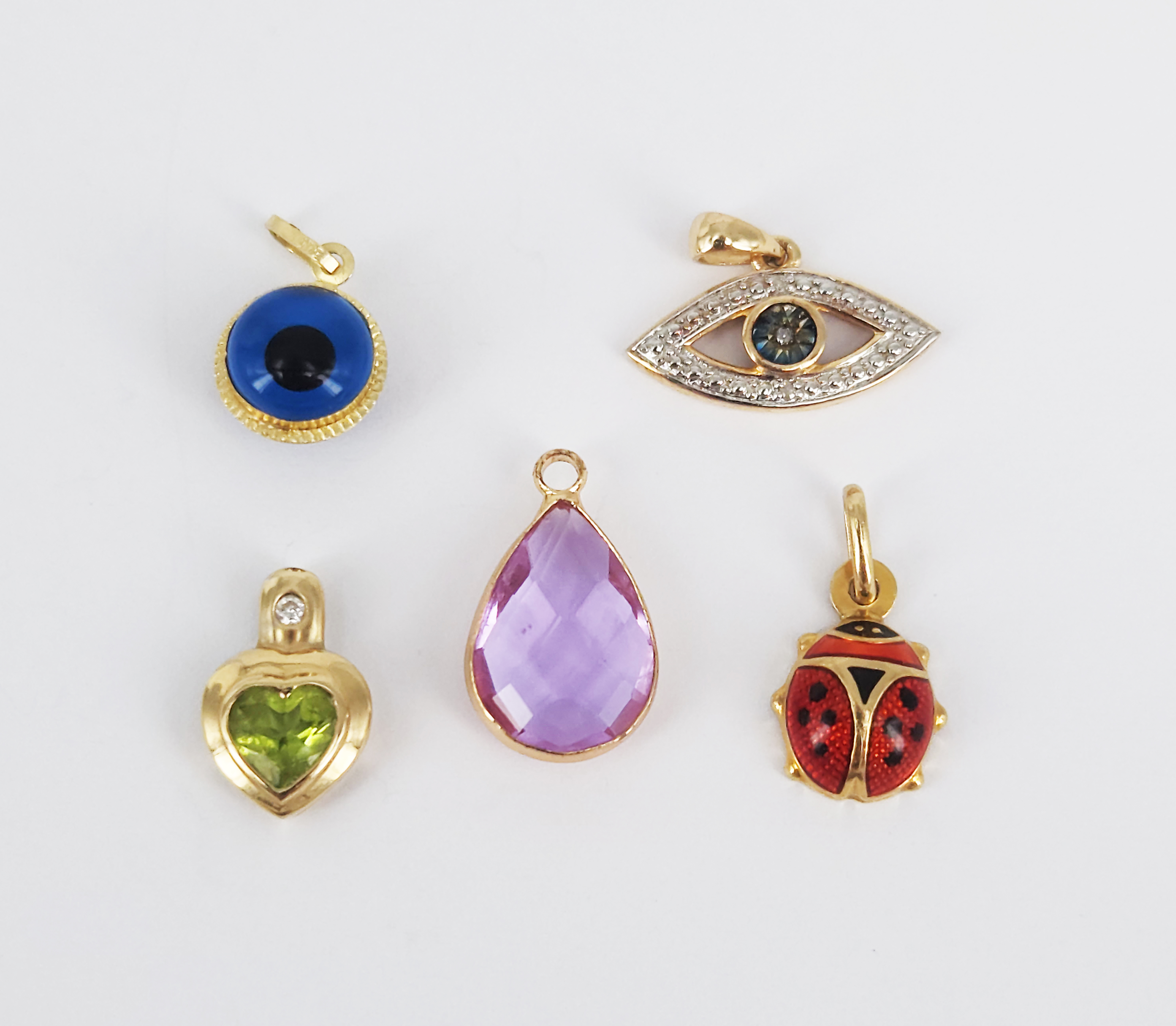 125 · FIVE 9ct YELLOW GOLD MOUNTED PENDANTS/CHARMS
