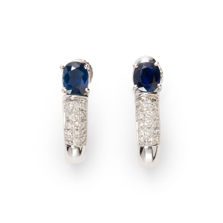 A pair of sapphire, diamond and fourteen karat white gold earrings