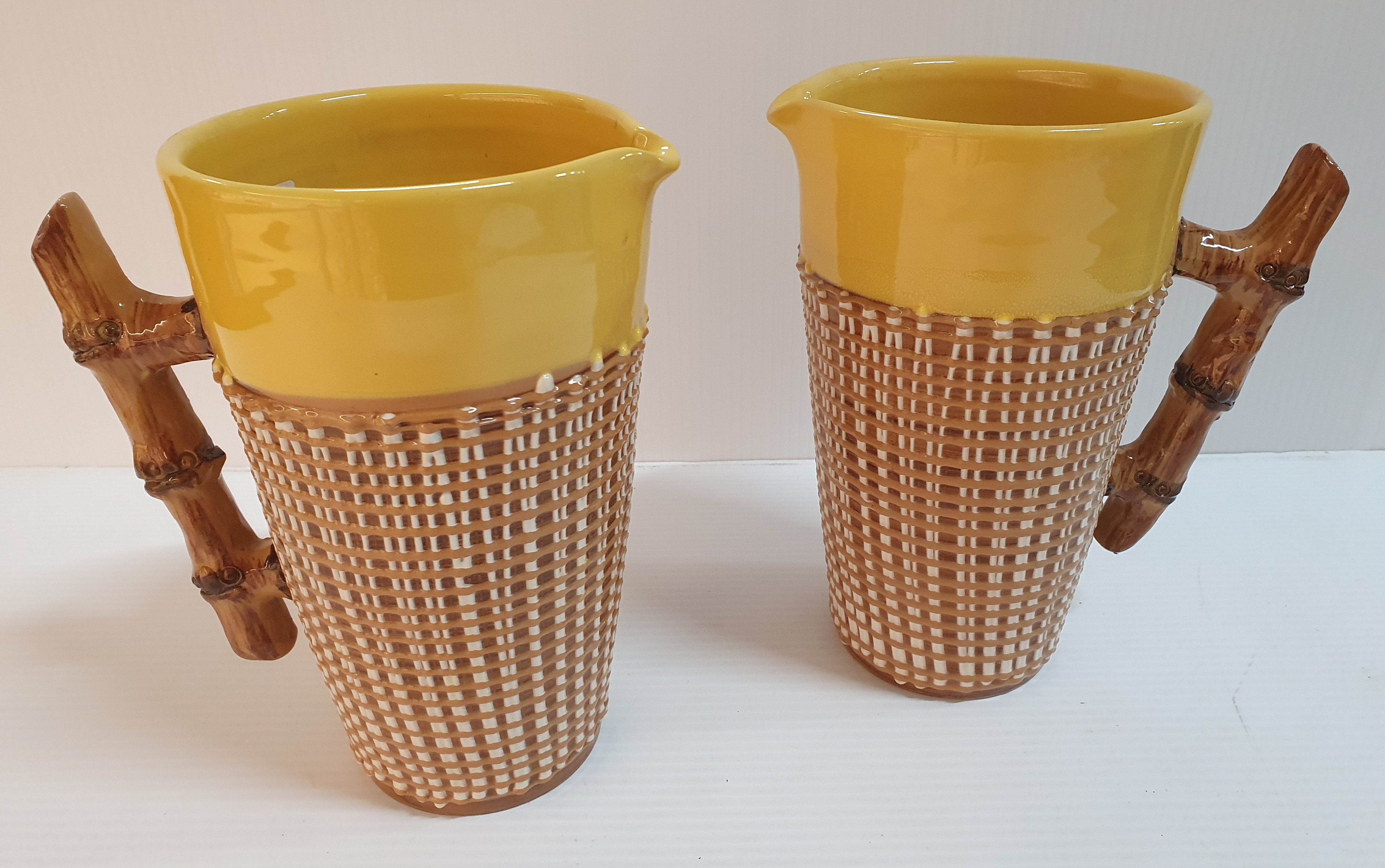36 · A PAIR OF ITALIAN GLAZED POTTERY JUGS