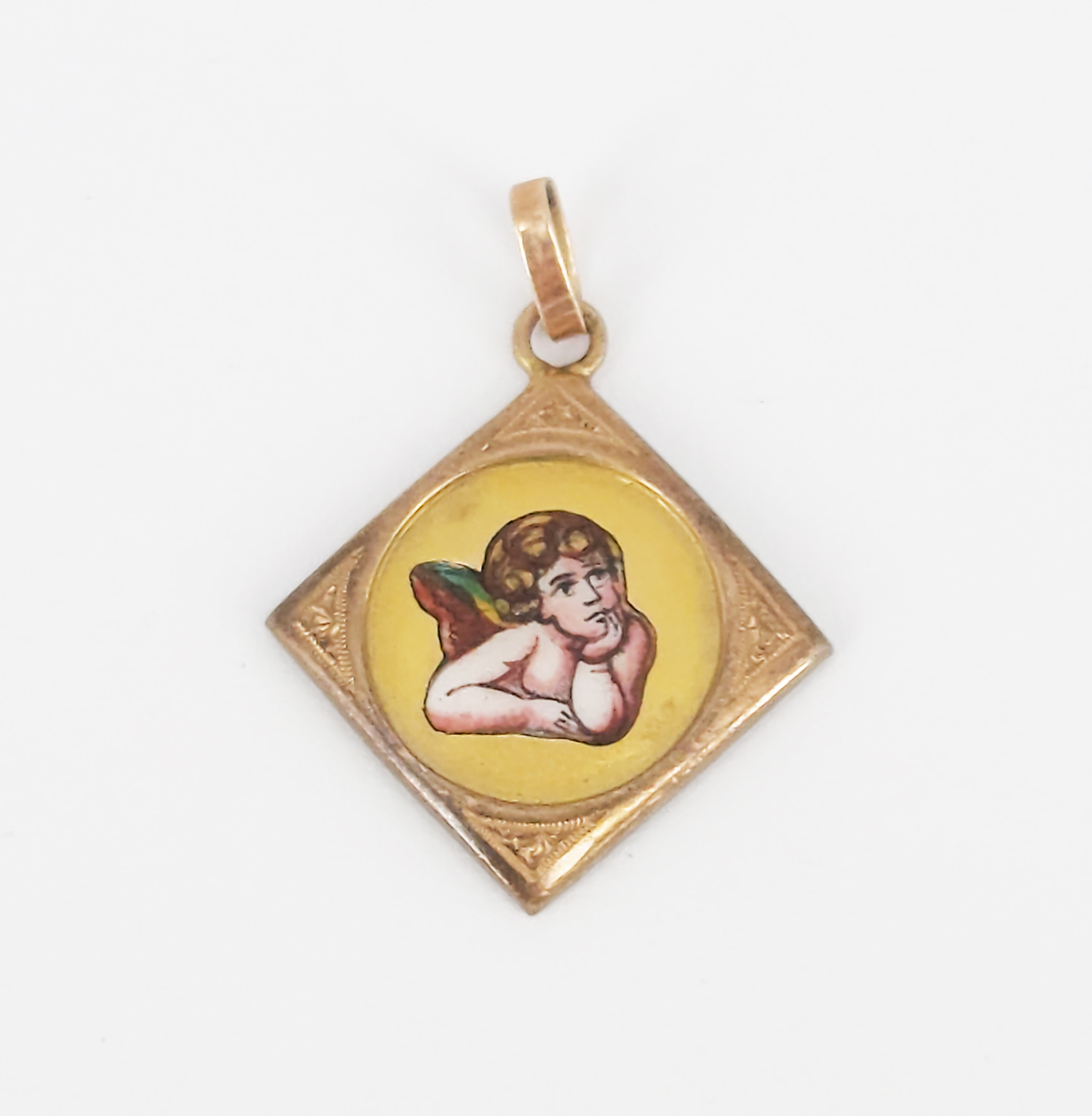 A Yellow Gold And Enamel Cherub Locket