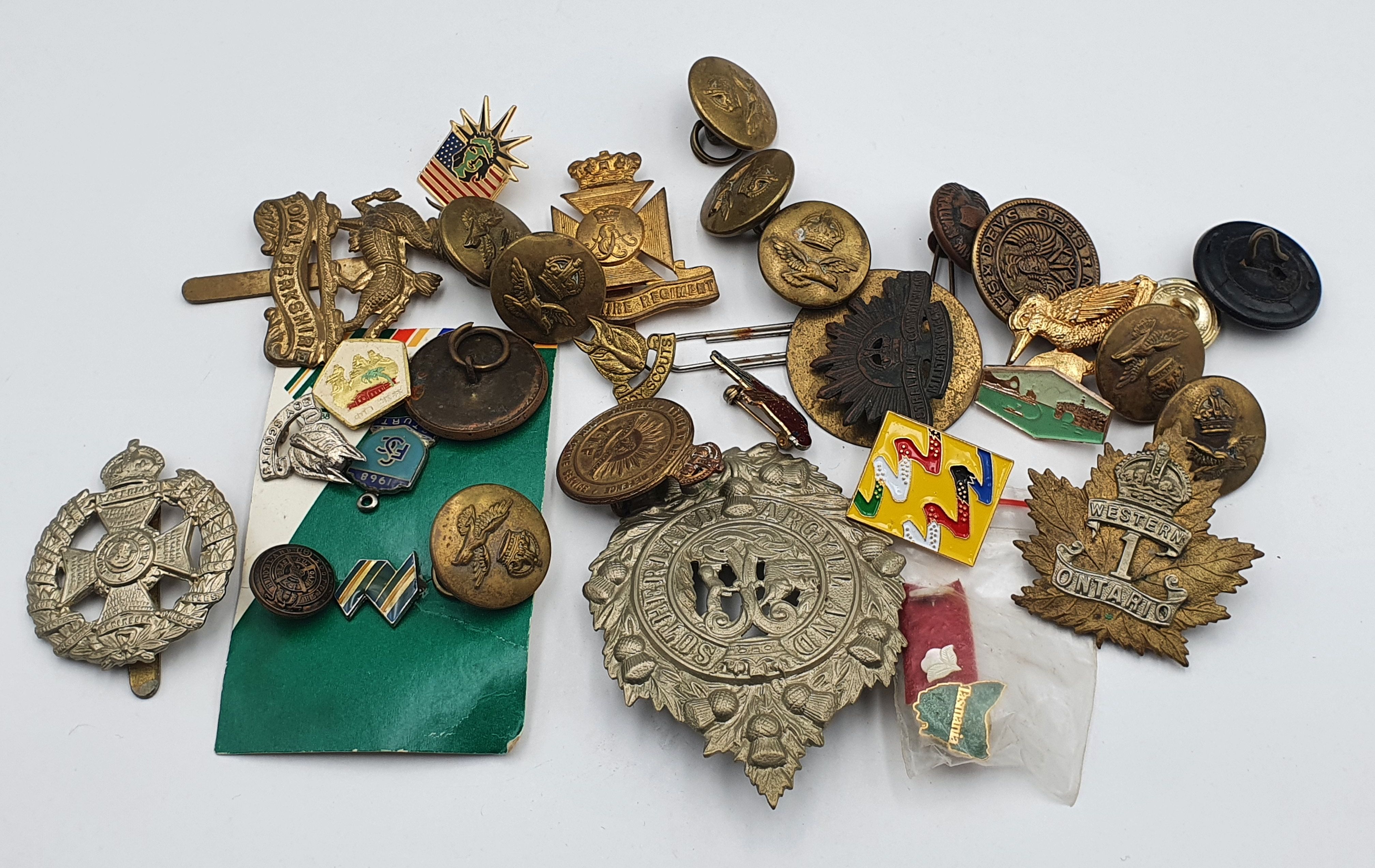A COLLECTION OF MILITARY BUTTONS AND BADGES AND OTHERS