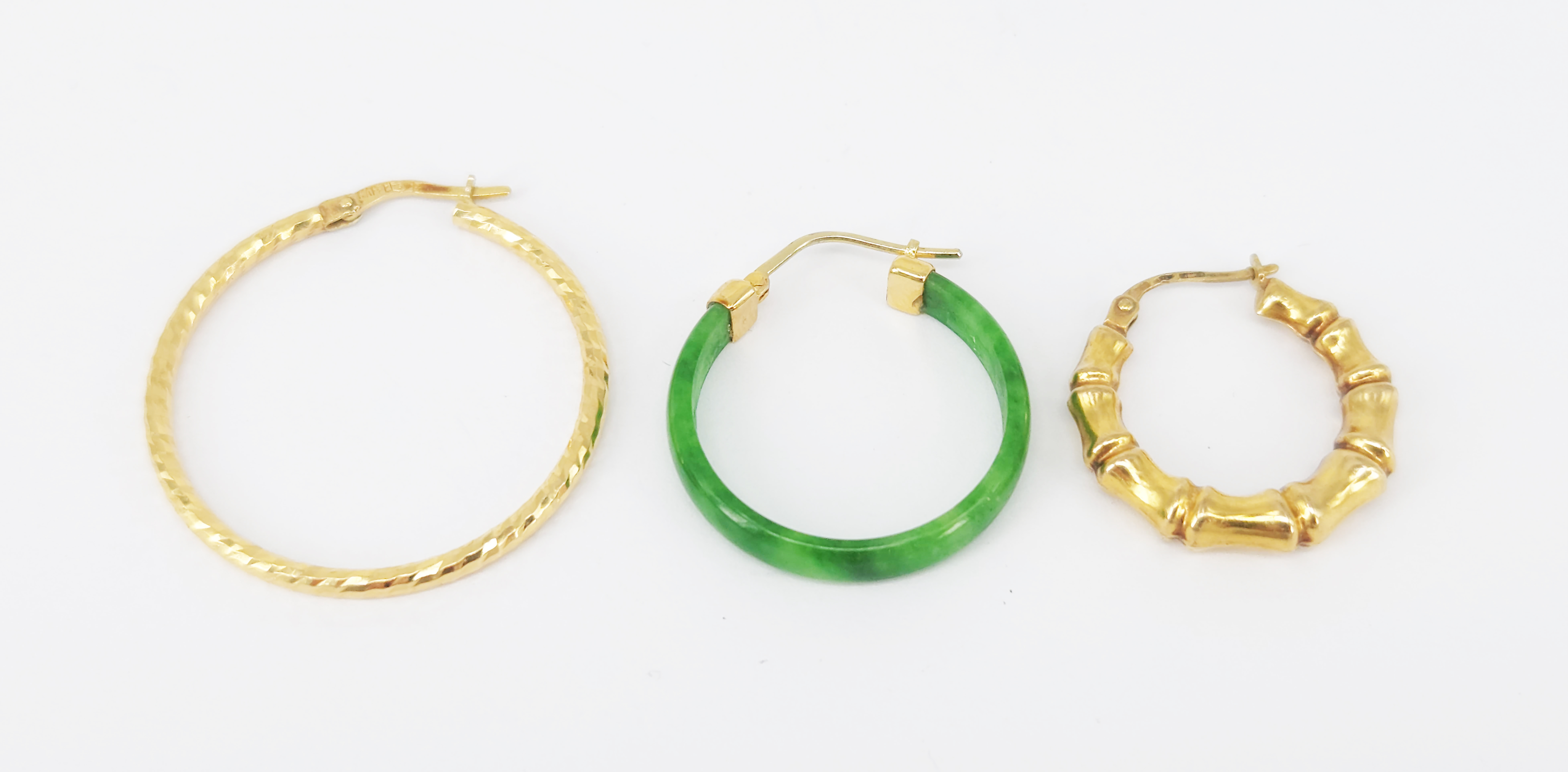 Two Single Gold Hoop Earrings