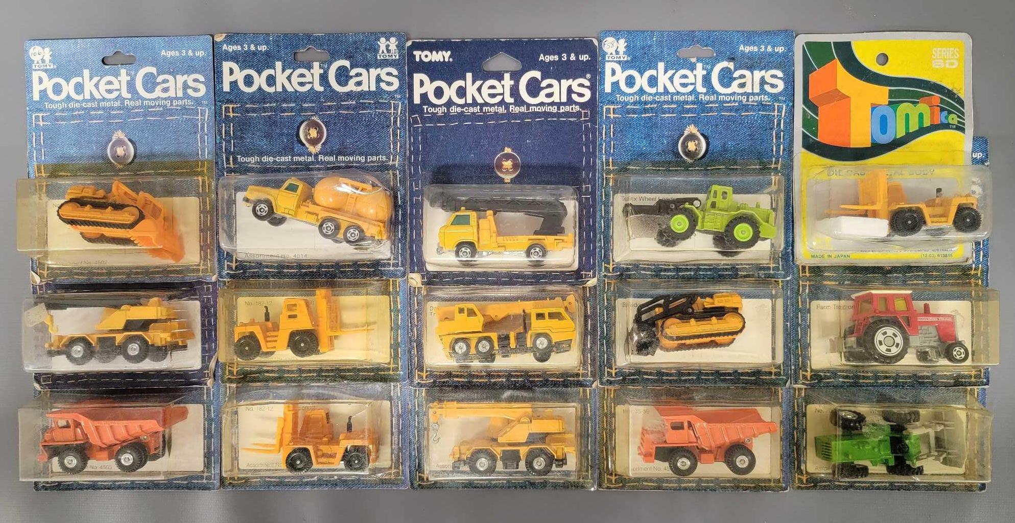 Sixteen Tomy Pocket farm and construction vehicles on original