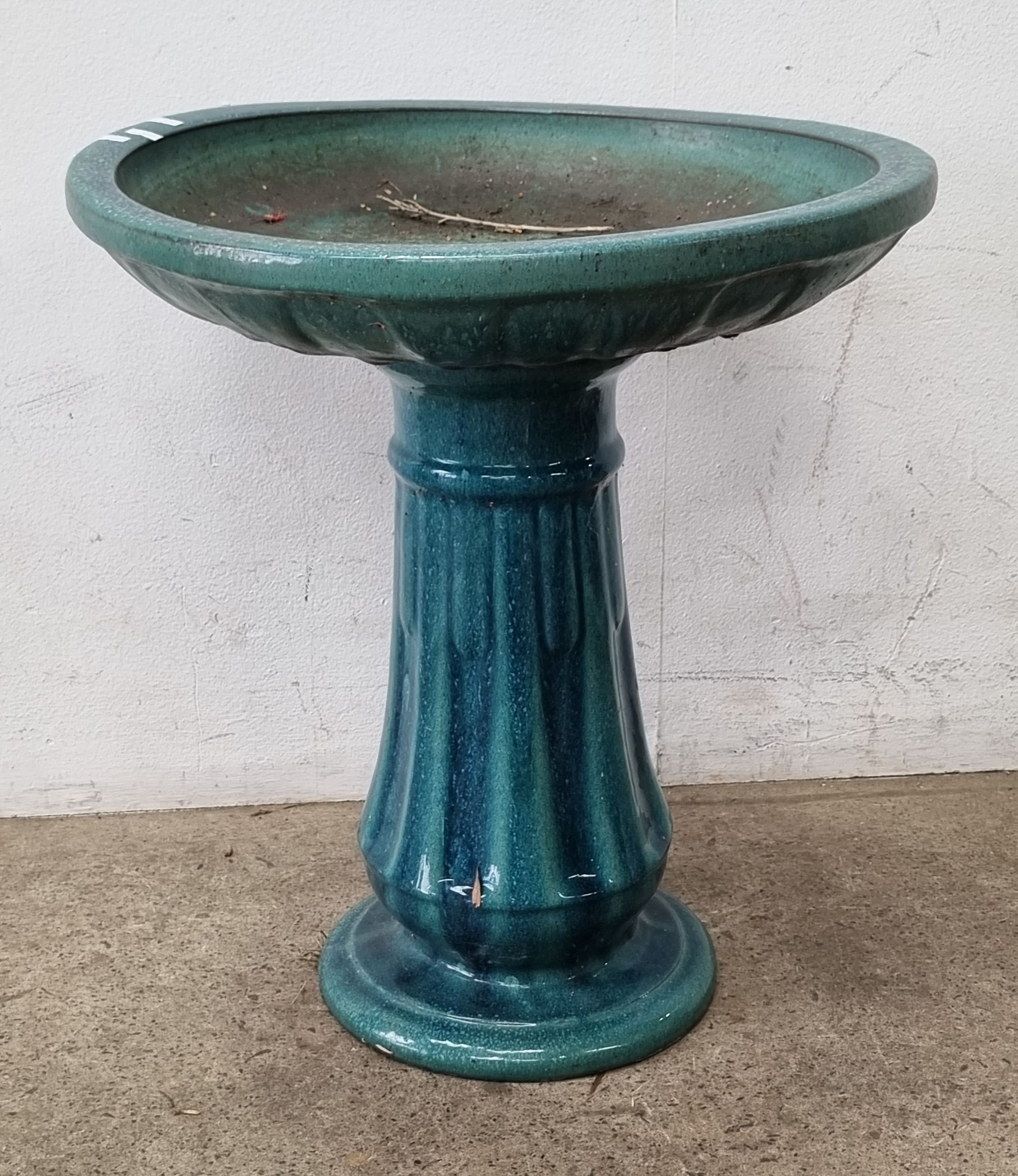 1061 · A TERRACOTTA GLAZED BIRD BATH