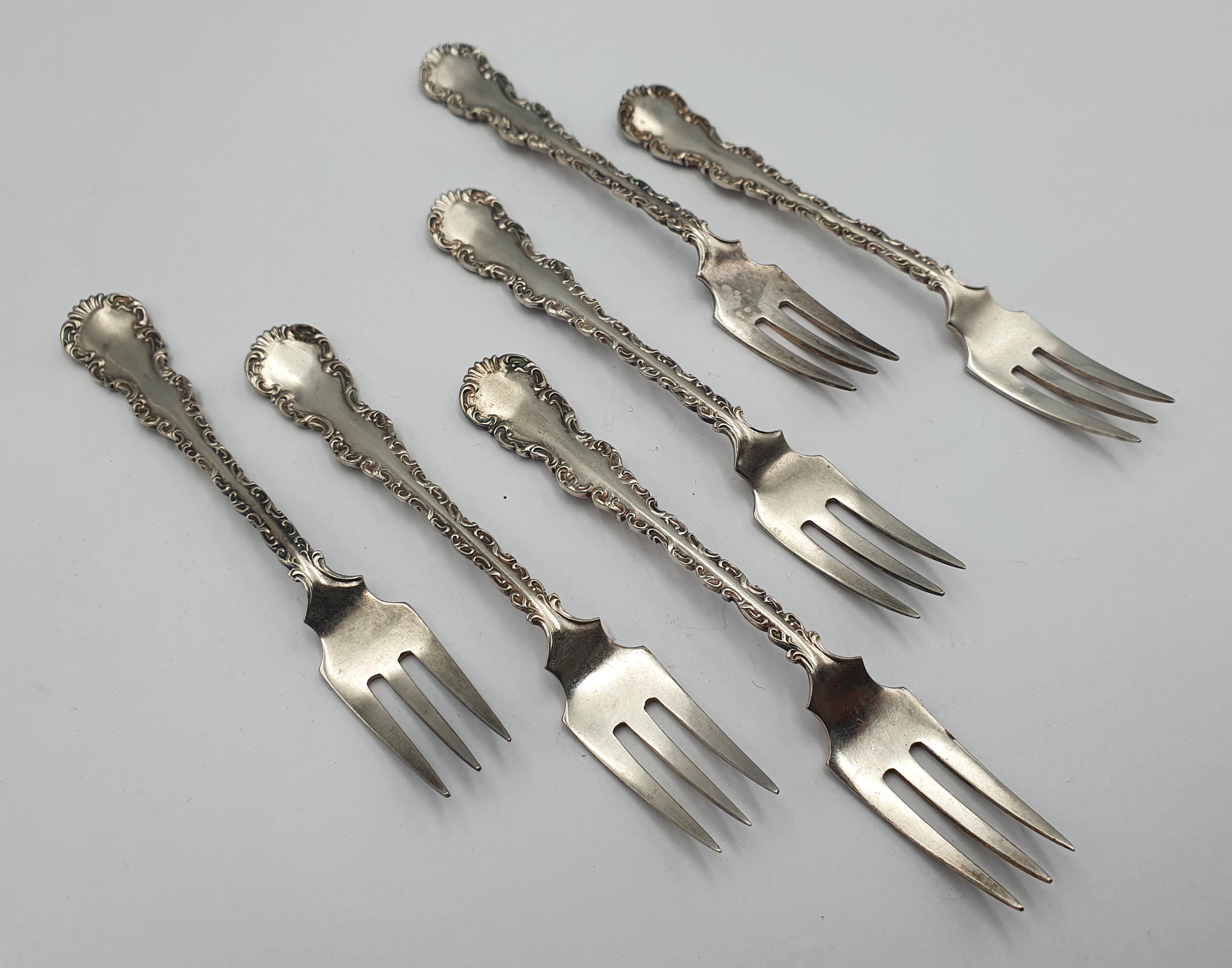 363 · A SET OF SIX SILVERPLATED CHEESE FORKS
