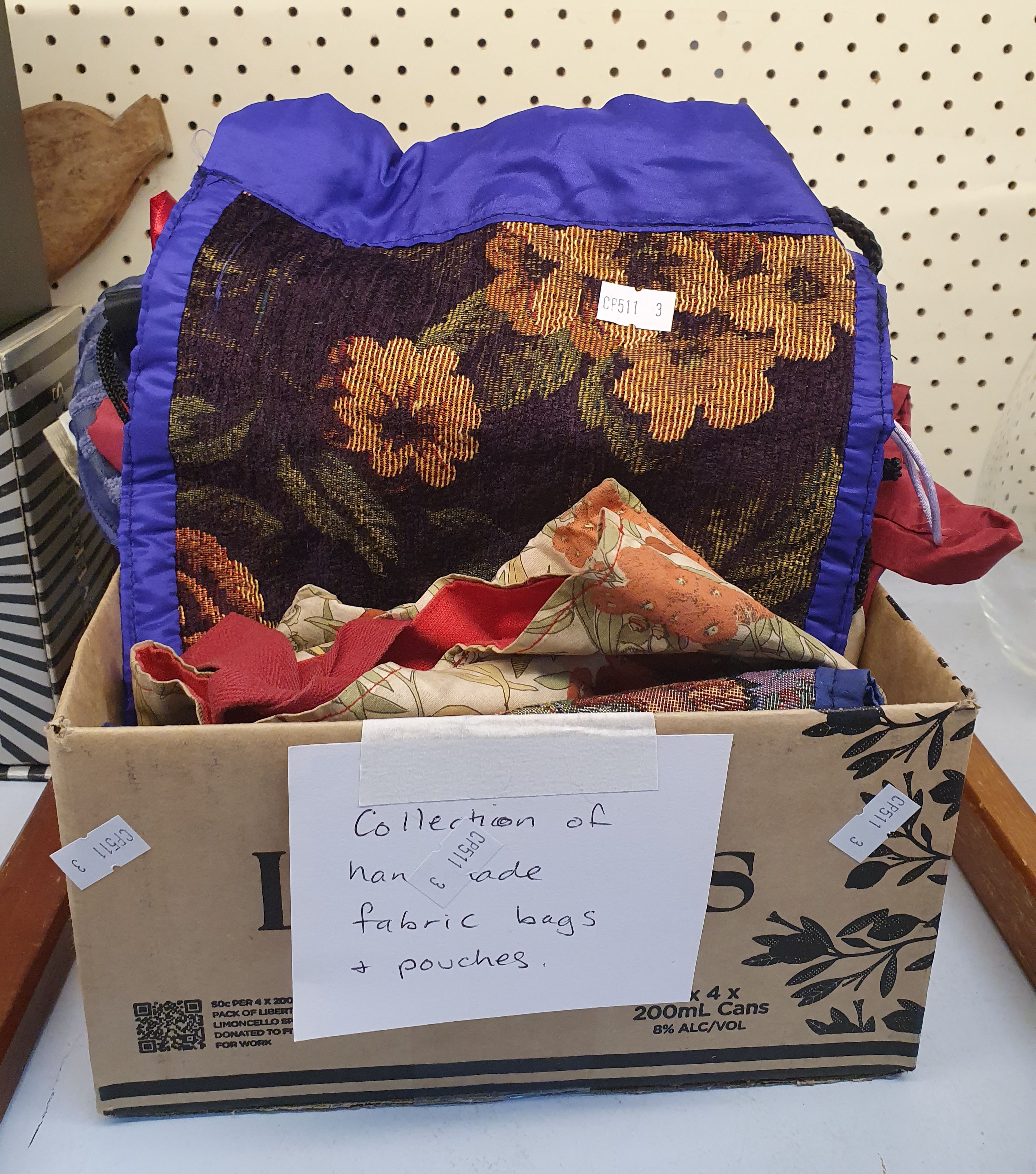 70 · A GROUP OF HANDMADE FABRIC BAGS AND POUCHES