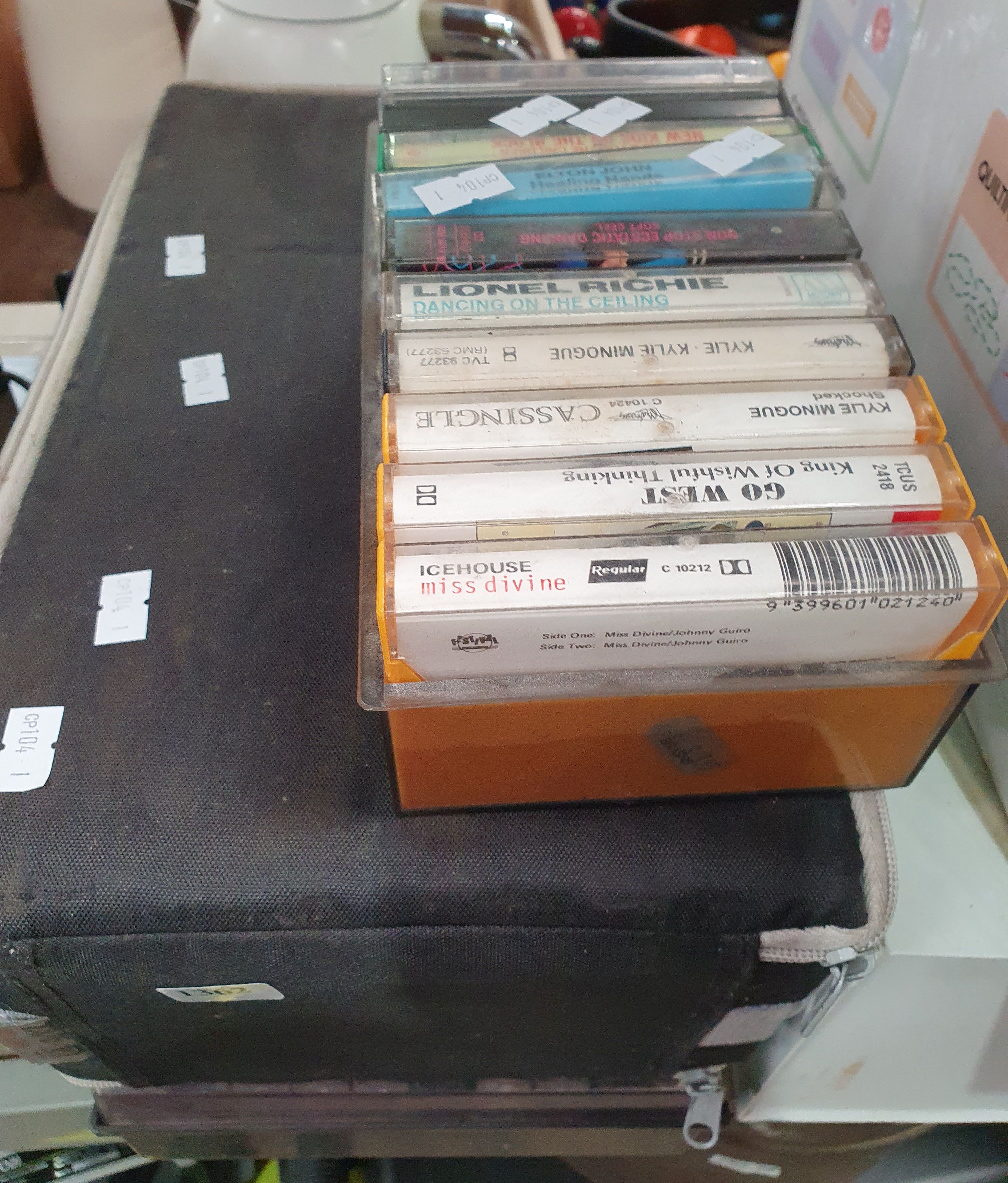 A Group Of Cassette Tapes And Records