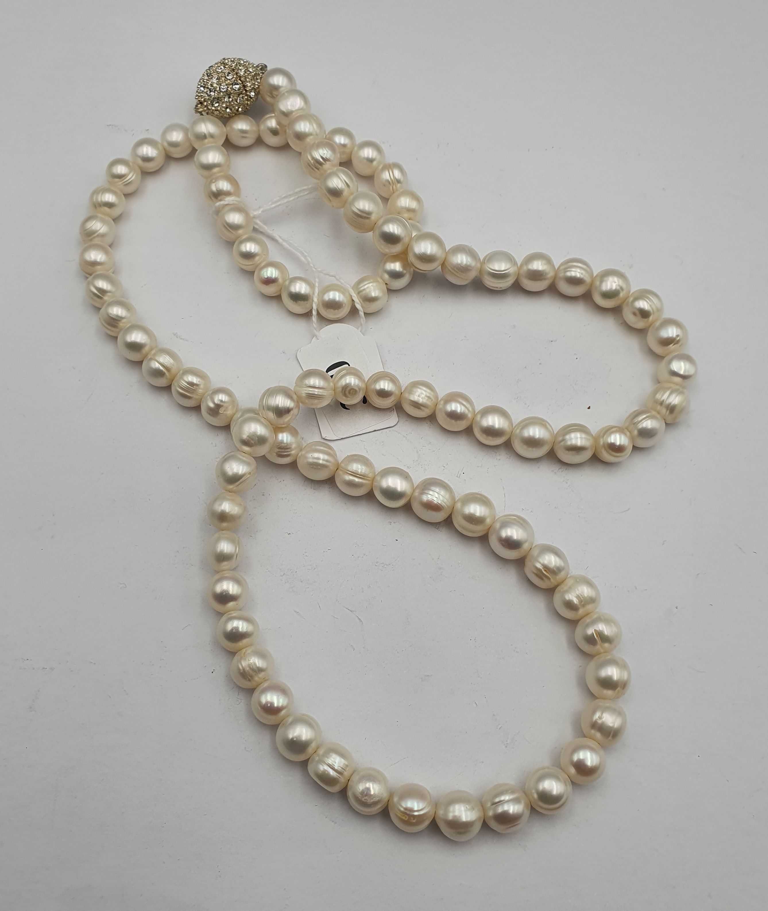 320 · AN OPERA LENGTH CULTURED PEARL NECKLACE