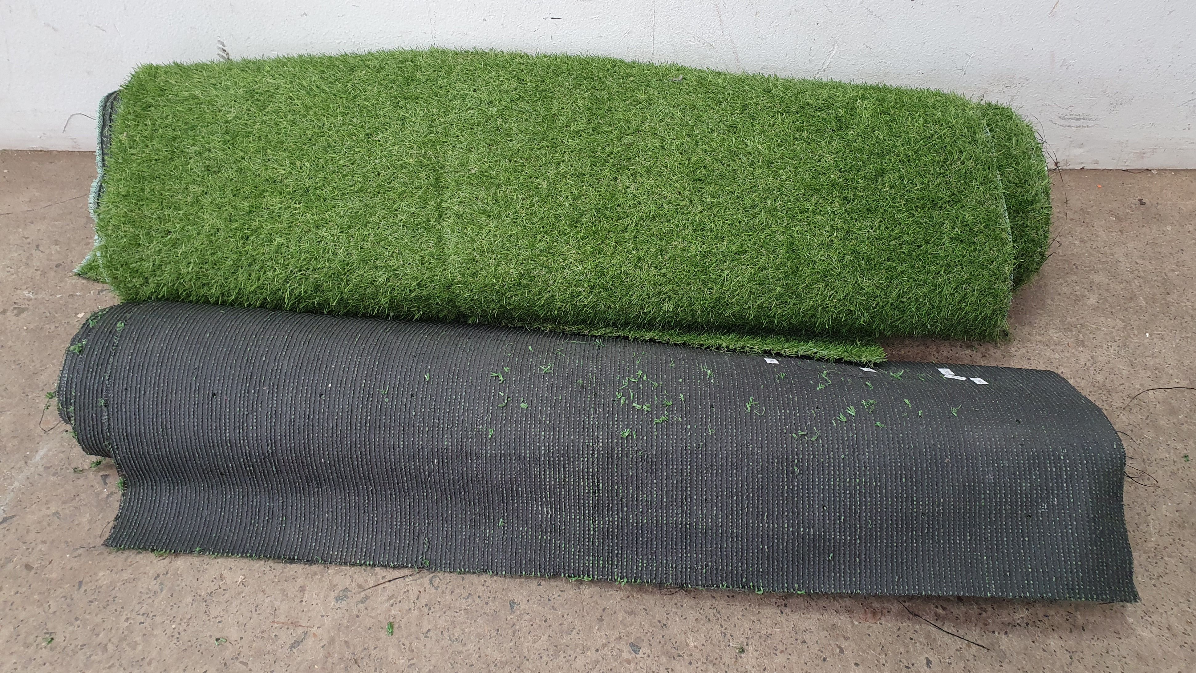 1084 · TWO ROLLS OF FAUX GRASS